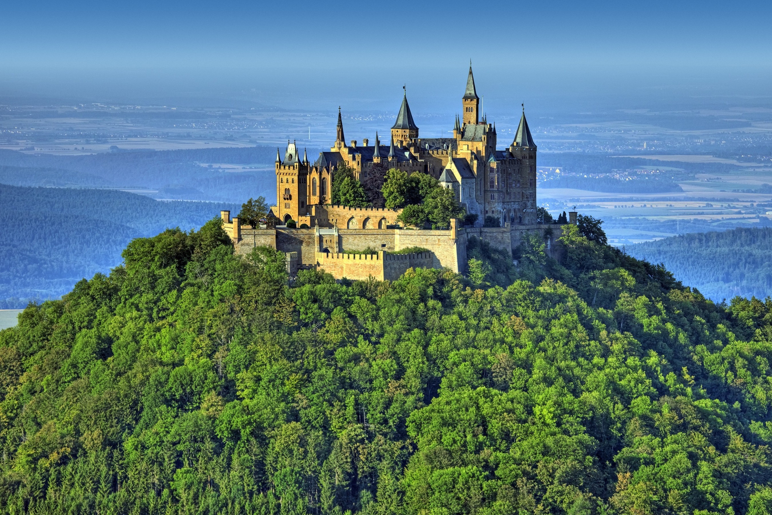 Majestic Hohenzollern Castle in a Forest Landscape HD Wallpaper