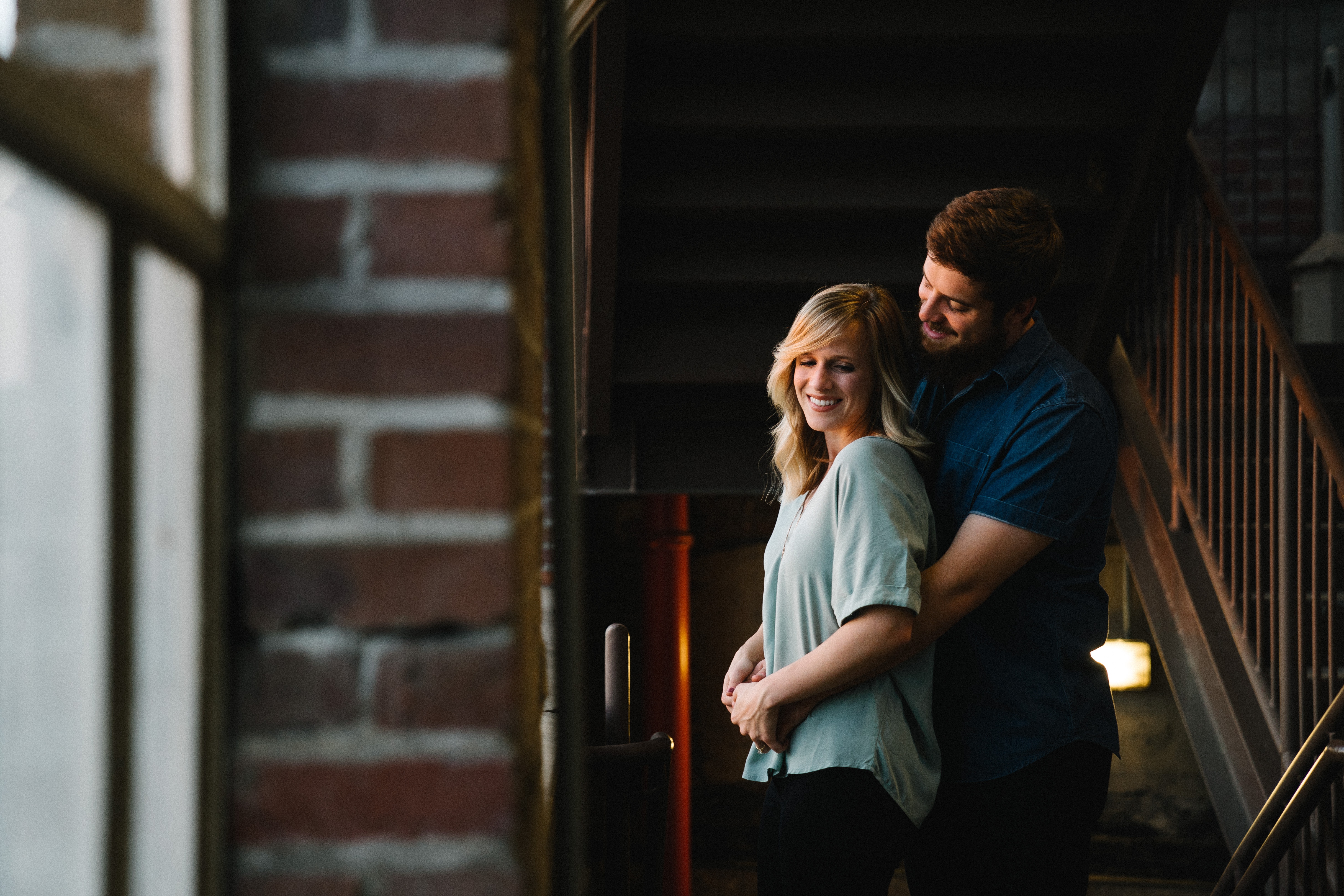 Couple embracing on a staircase HD Wallpaper