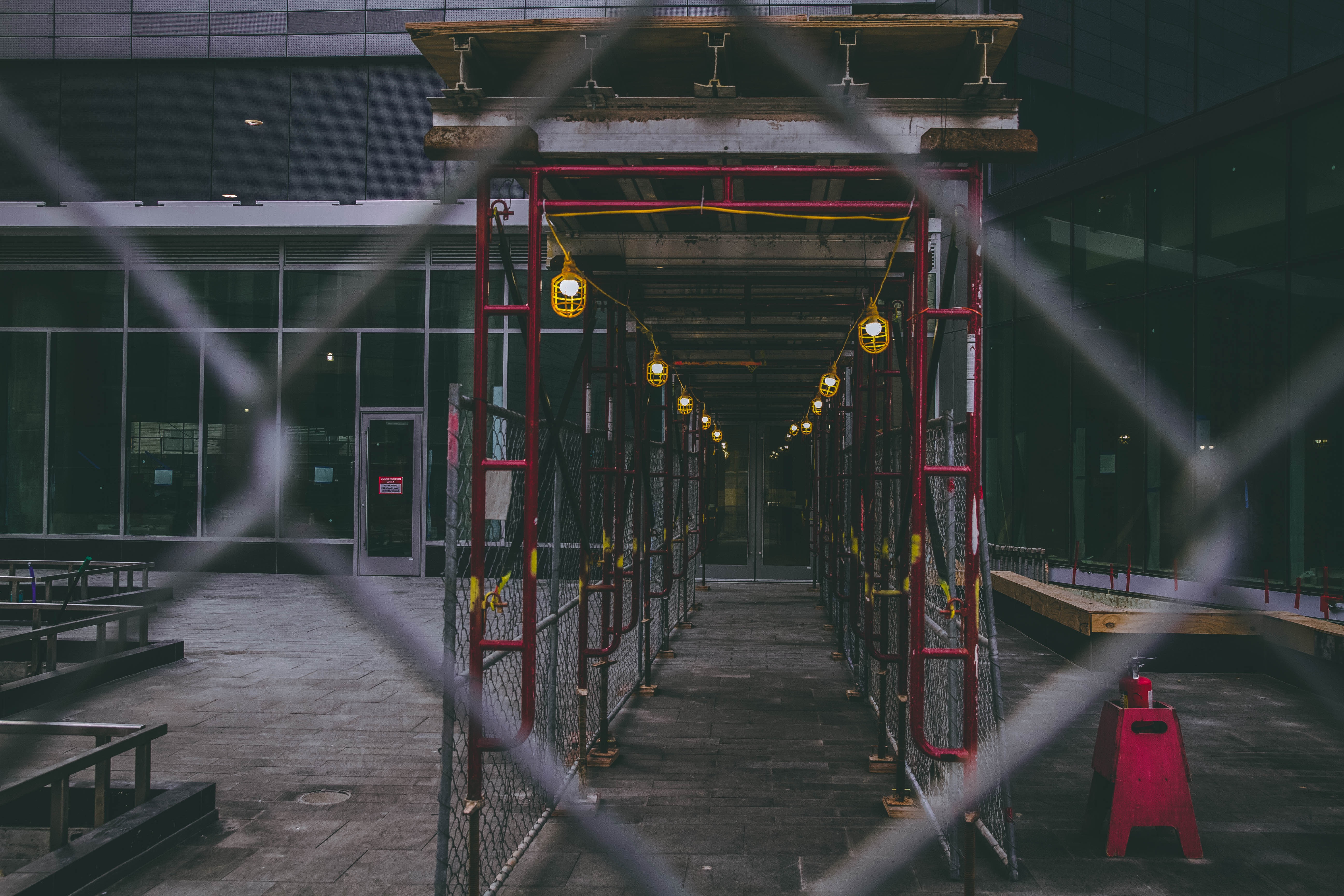 Scaffolding and lights on a city building site HD Wallpaper