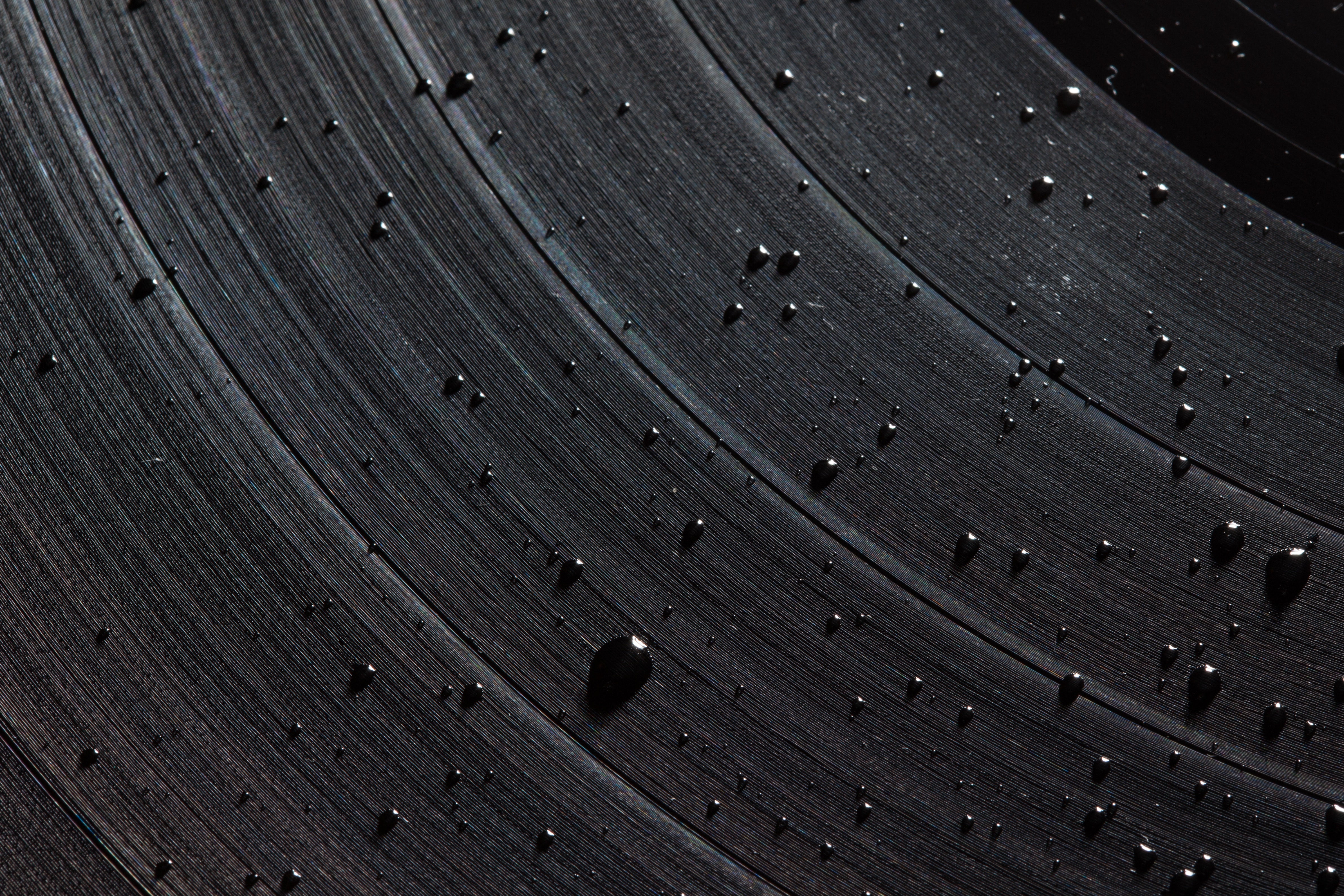 Close-up of a vinyl record with water droplets HD Wallpaper