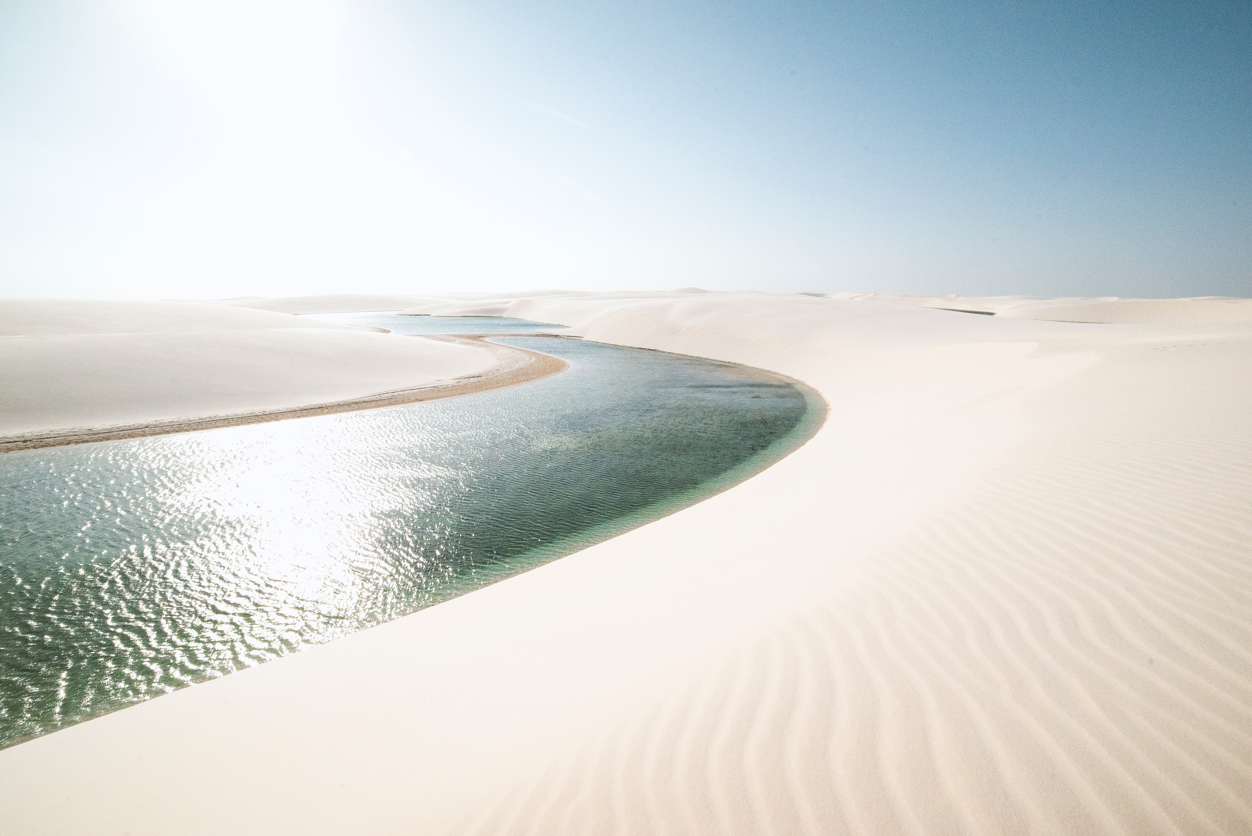 Lagoon in the sand dunes of Lençóis Maranhenses, Brazil HD Wallpaper