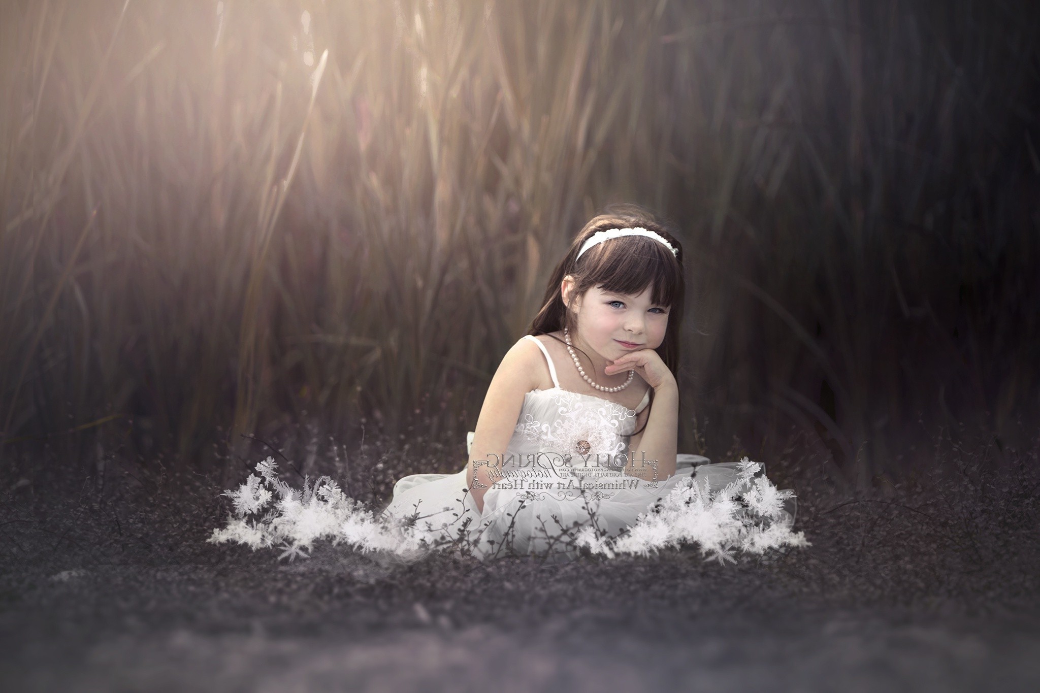 Young girl in white dress sitting in tall grass HD Wallpaper