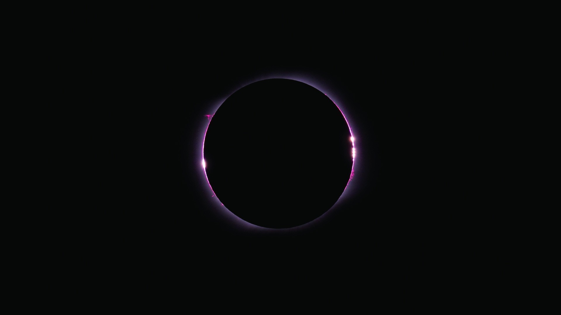 Solar eclipse with pink corona HD Wallpaper