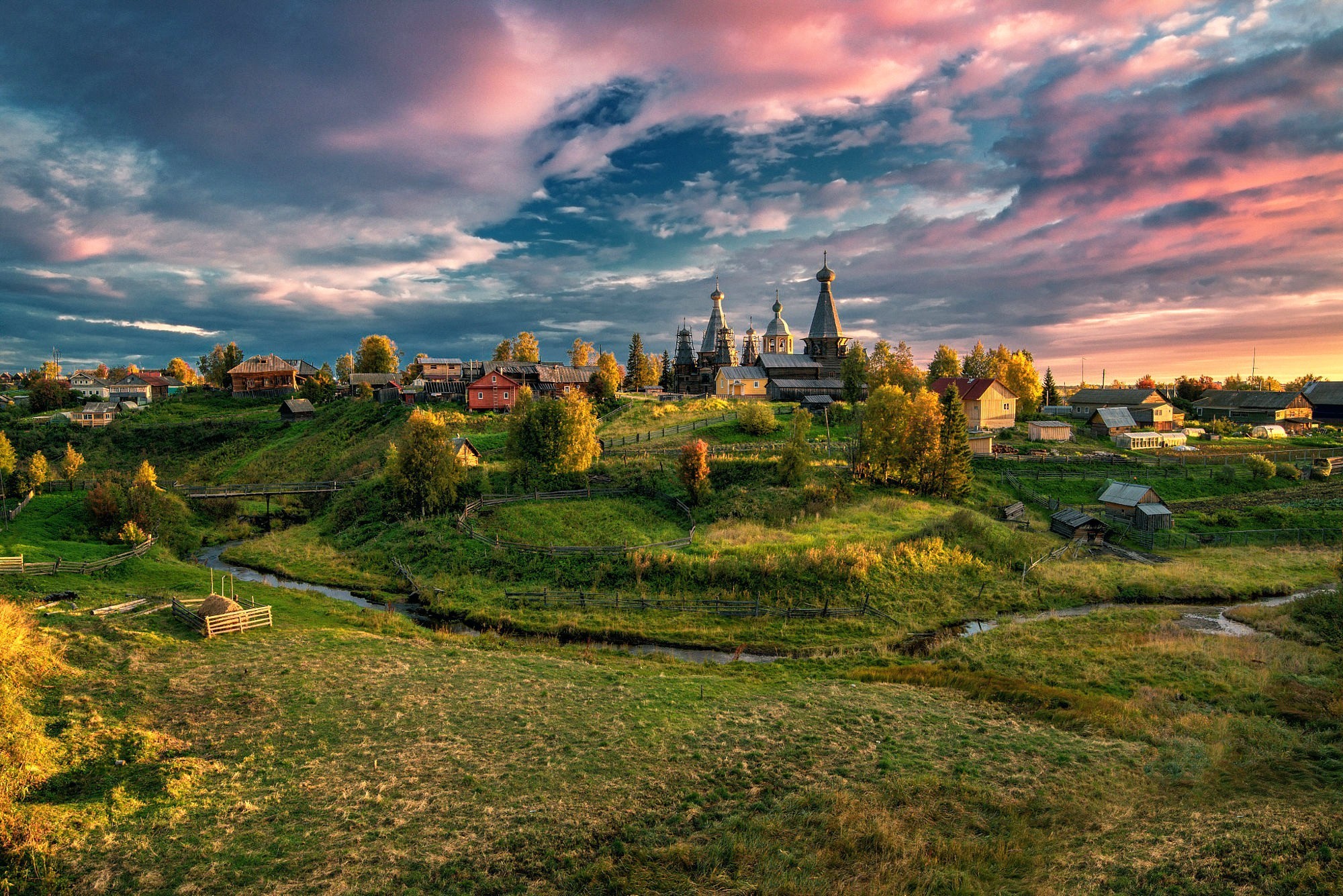 Village with churches and river at sunset HD Wallpaper