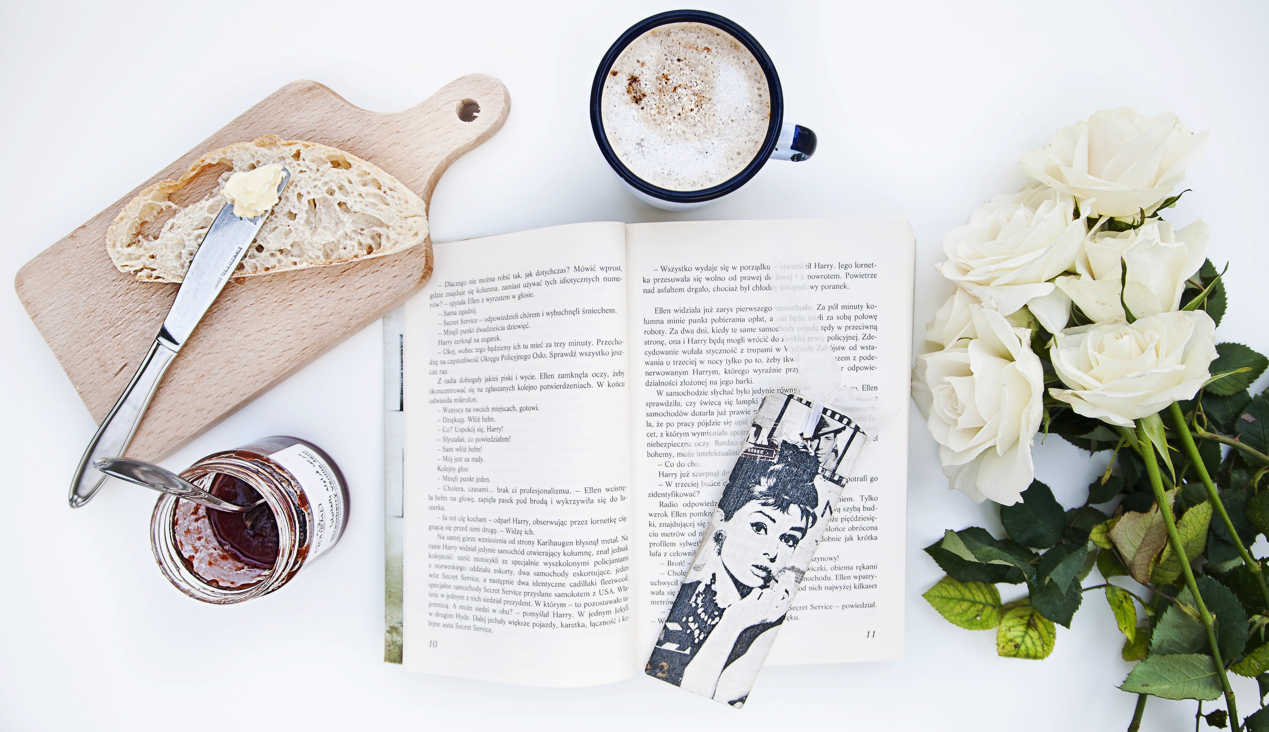 Open book with Audrey Hepburn bookmark, coffee, toast, jam, and roses HD Wallpaper