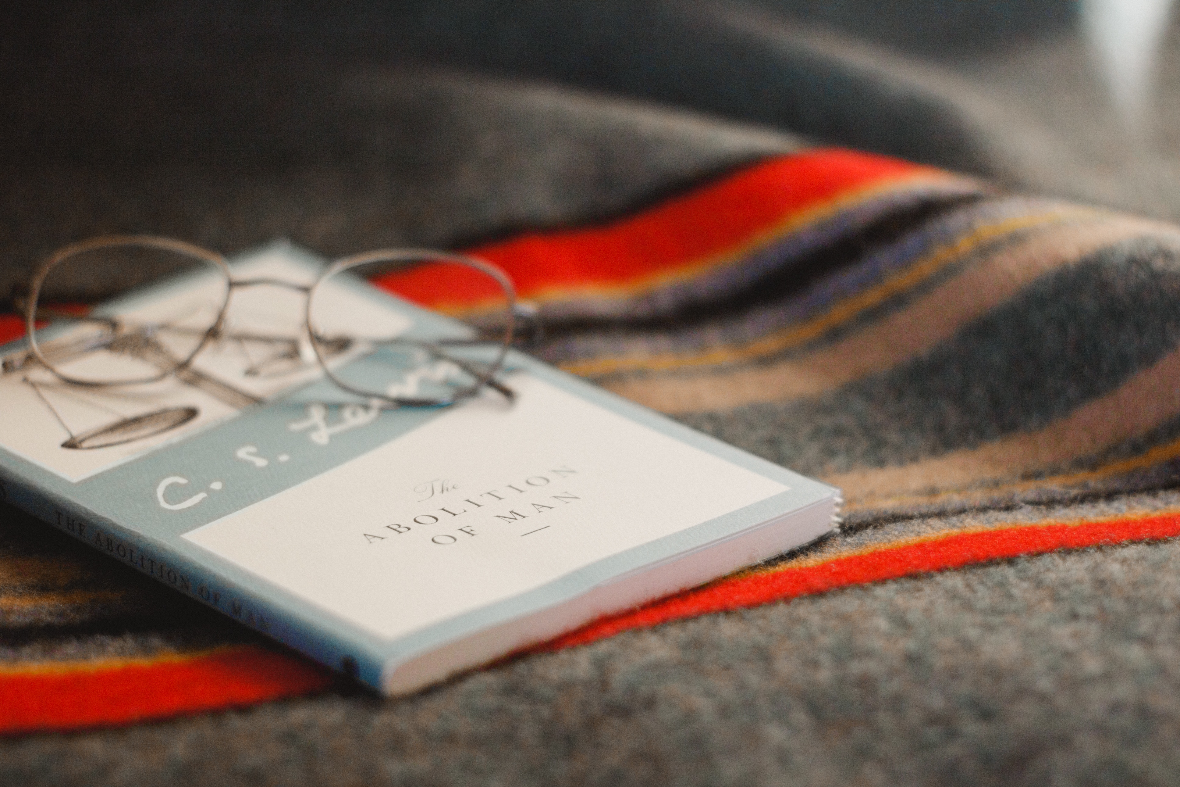 C.S. Lewis's The Abolition of Man book with glasses HD Wallpaper