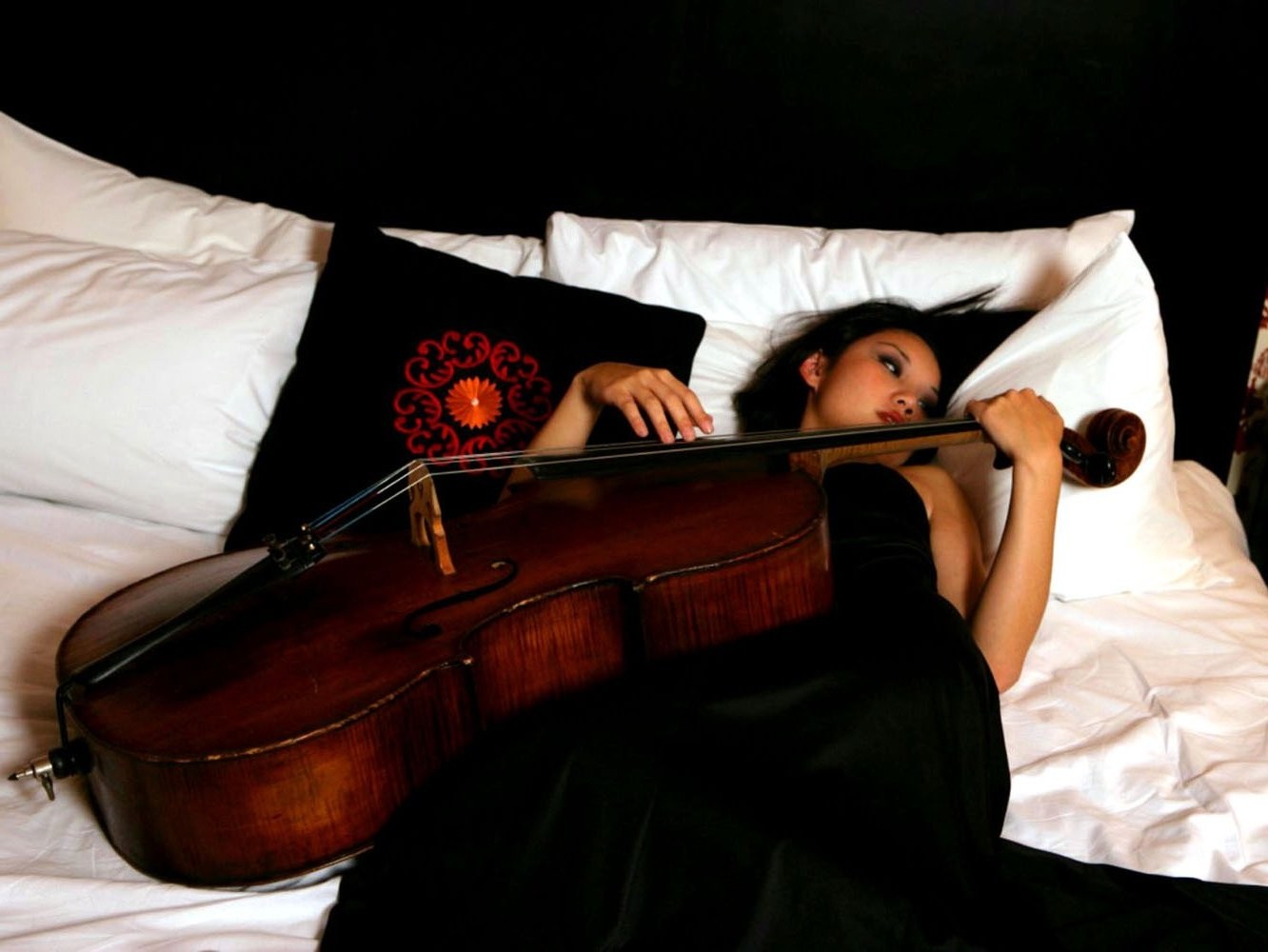 Tina Guo with Cello on Bed HD Wallpaper