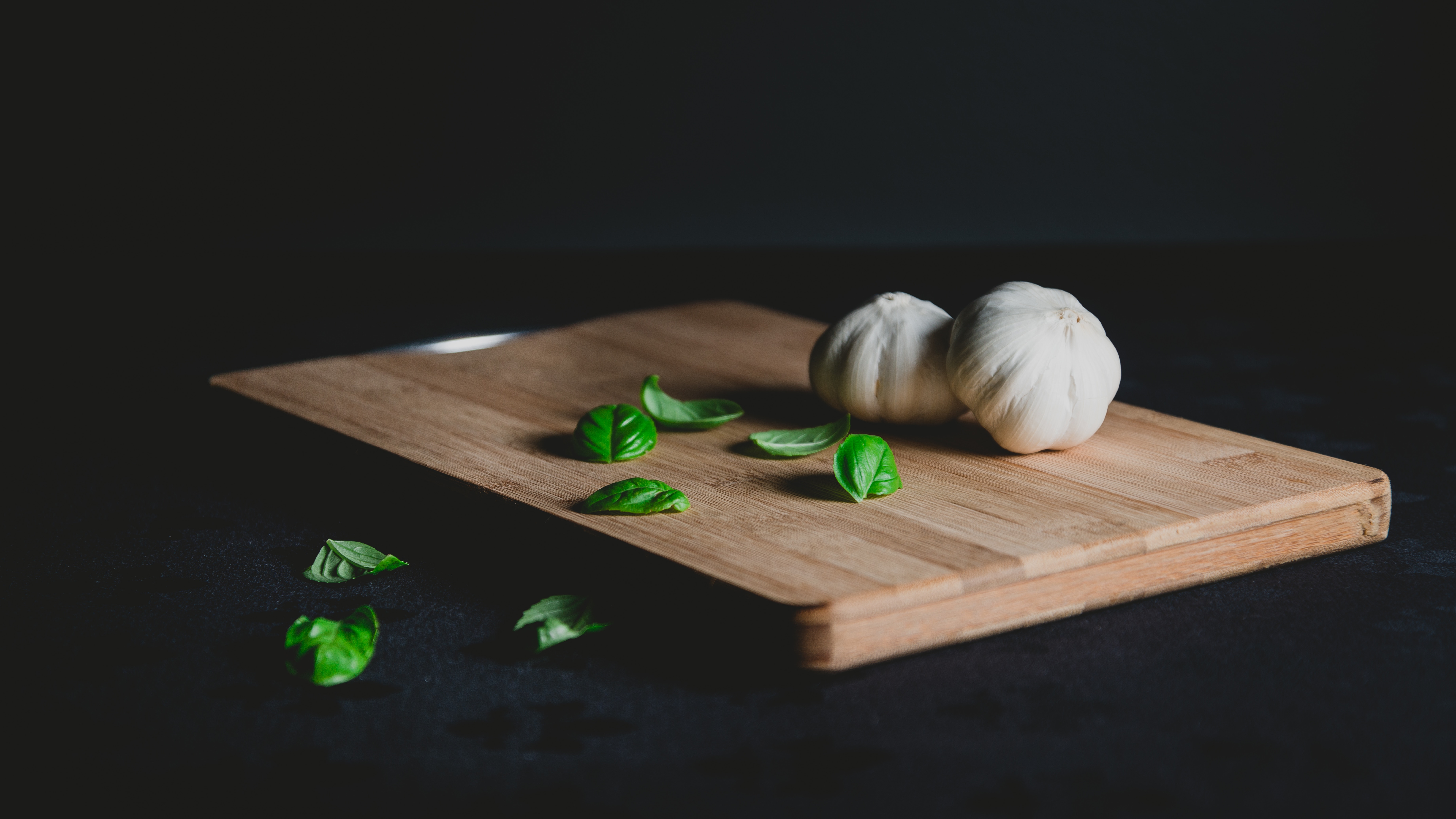 Garlic Bulbs and Fresh Basil on Wooden Cutting Board HD Wallpaper