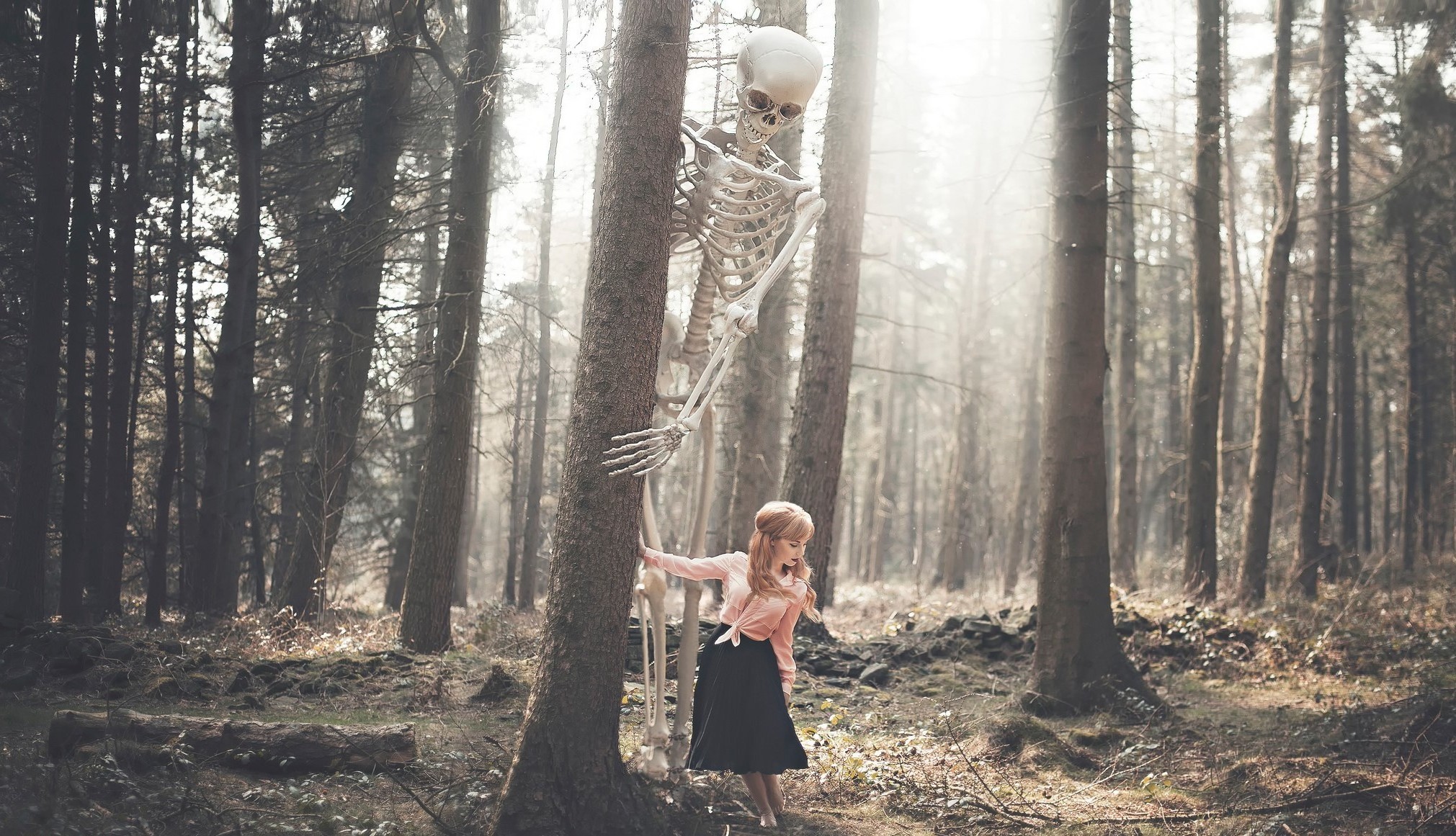 Skeleton and girl in a misty forest HD Wallpaper