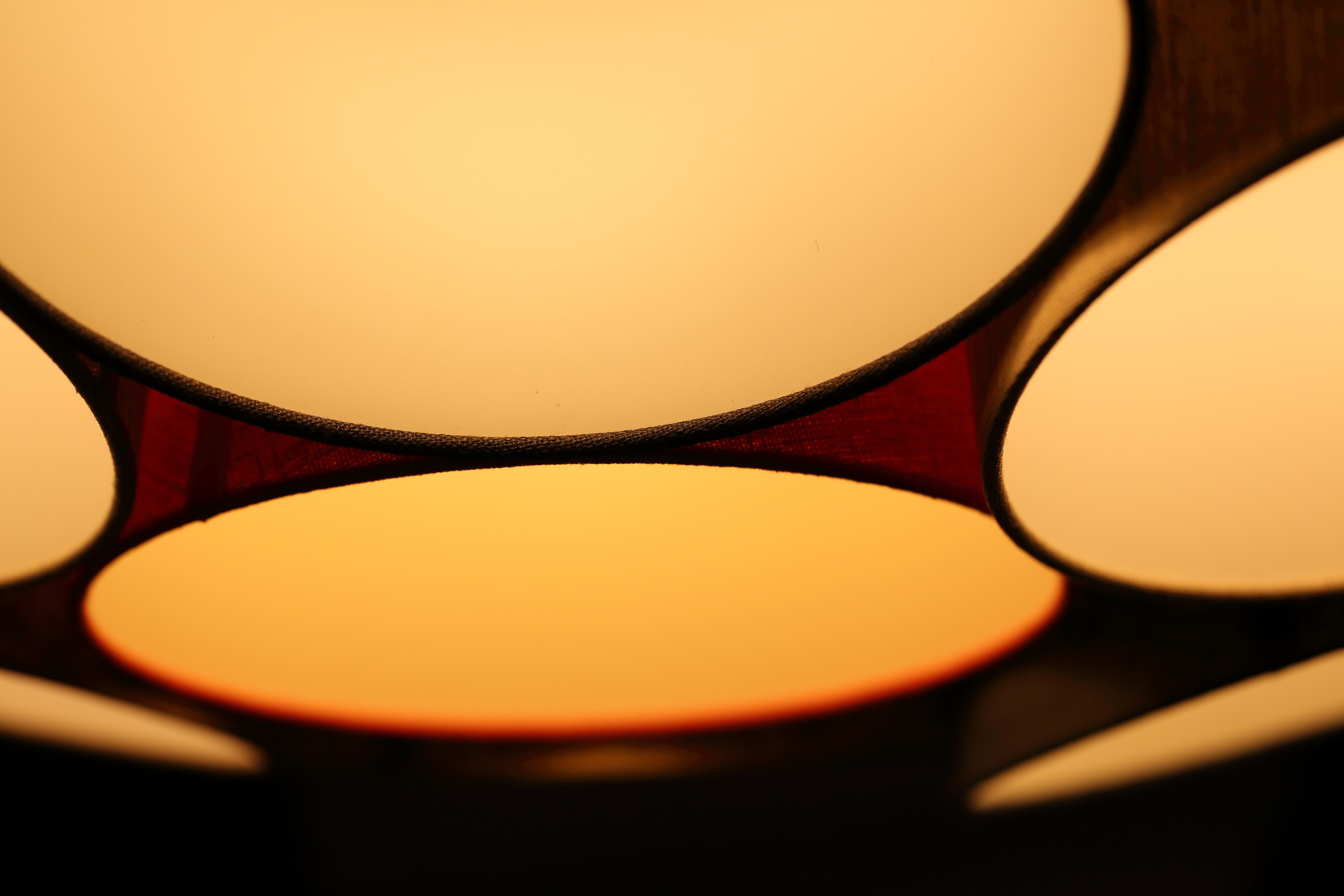Abstract close-up of a yellow and orange lampshade HD Wallpaper