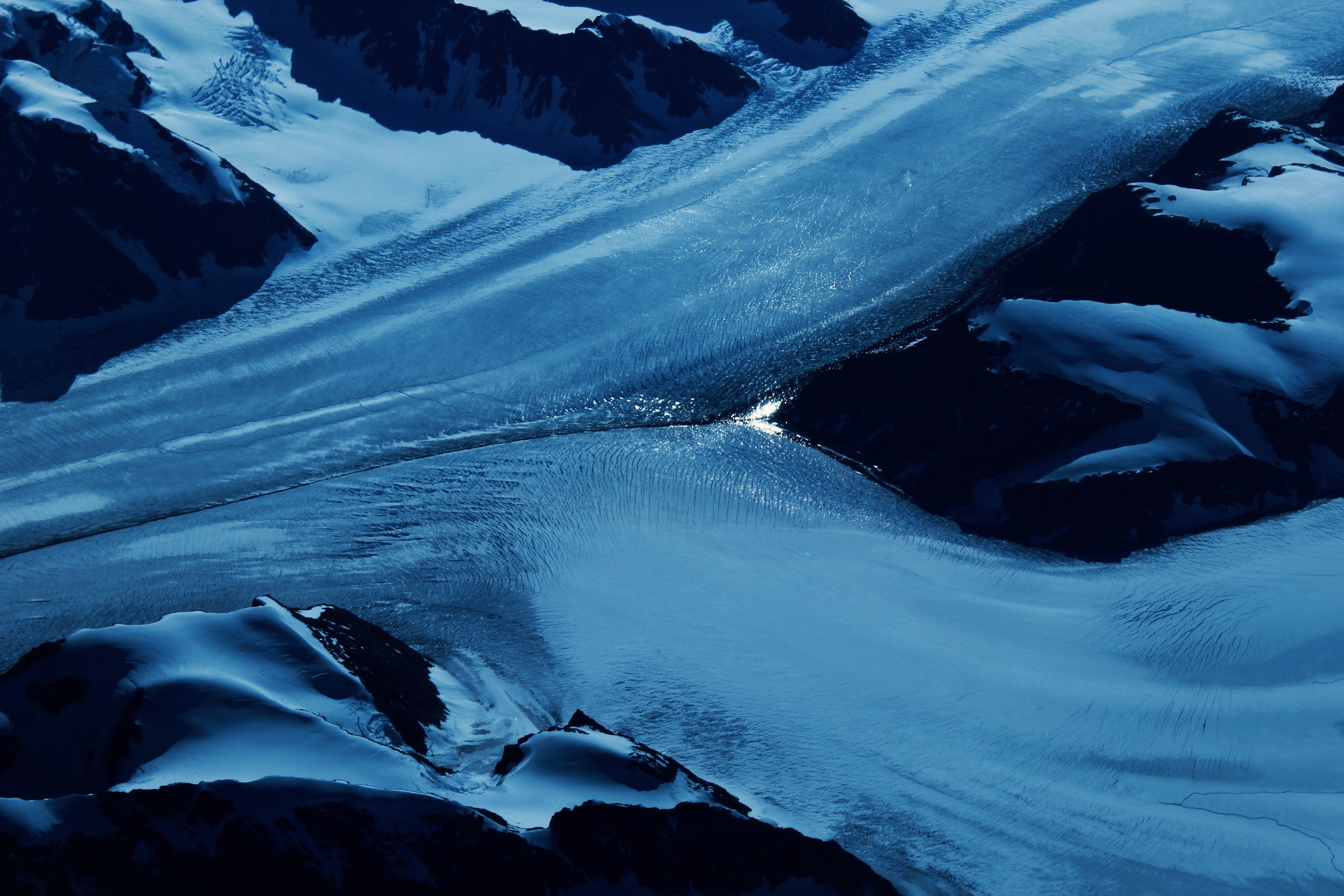 Aerial view of a vast blue glacier in Iceland HD Wallpaper