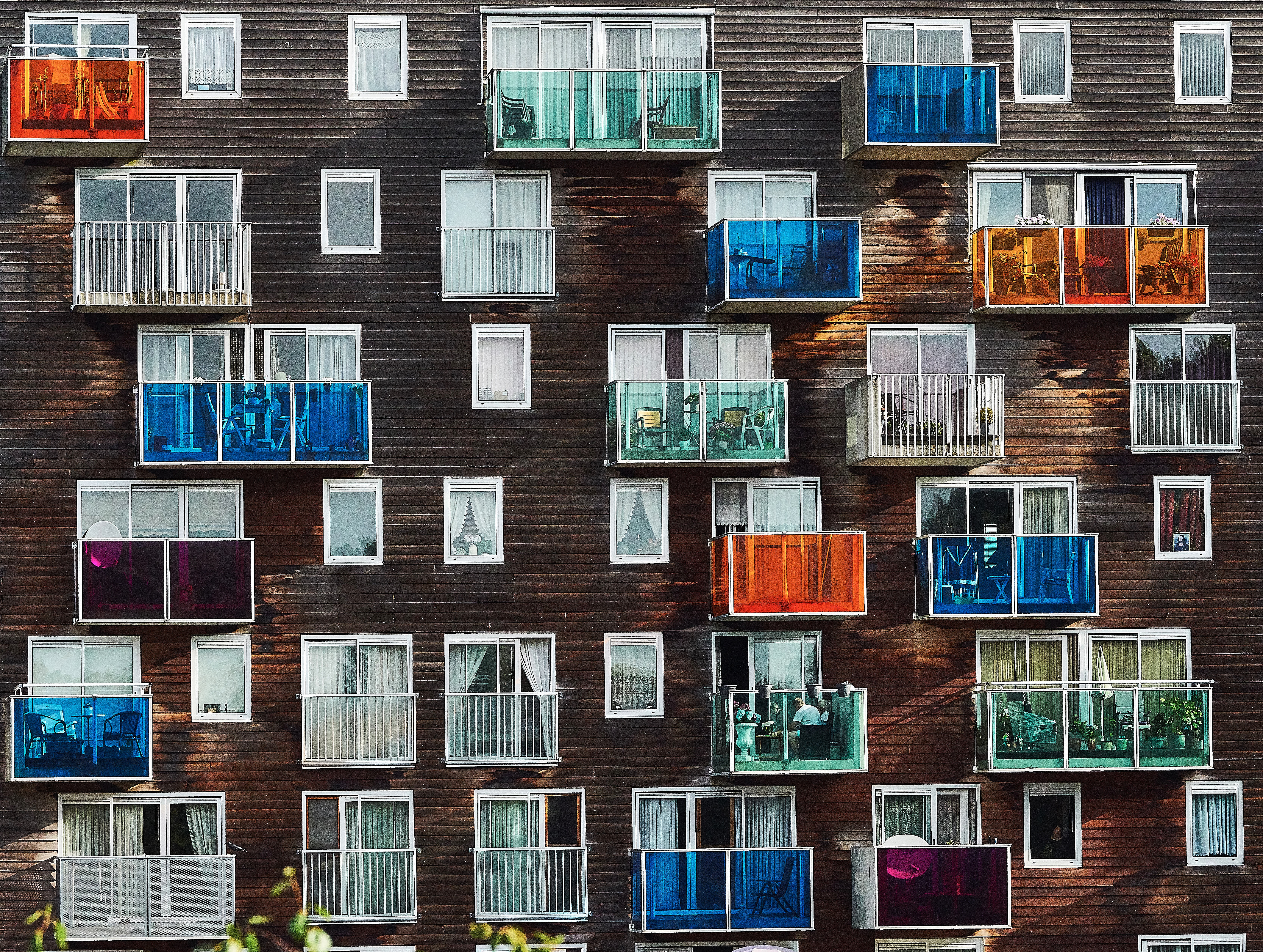 Building with colorful balconies and windows HD Wallpaper