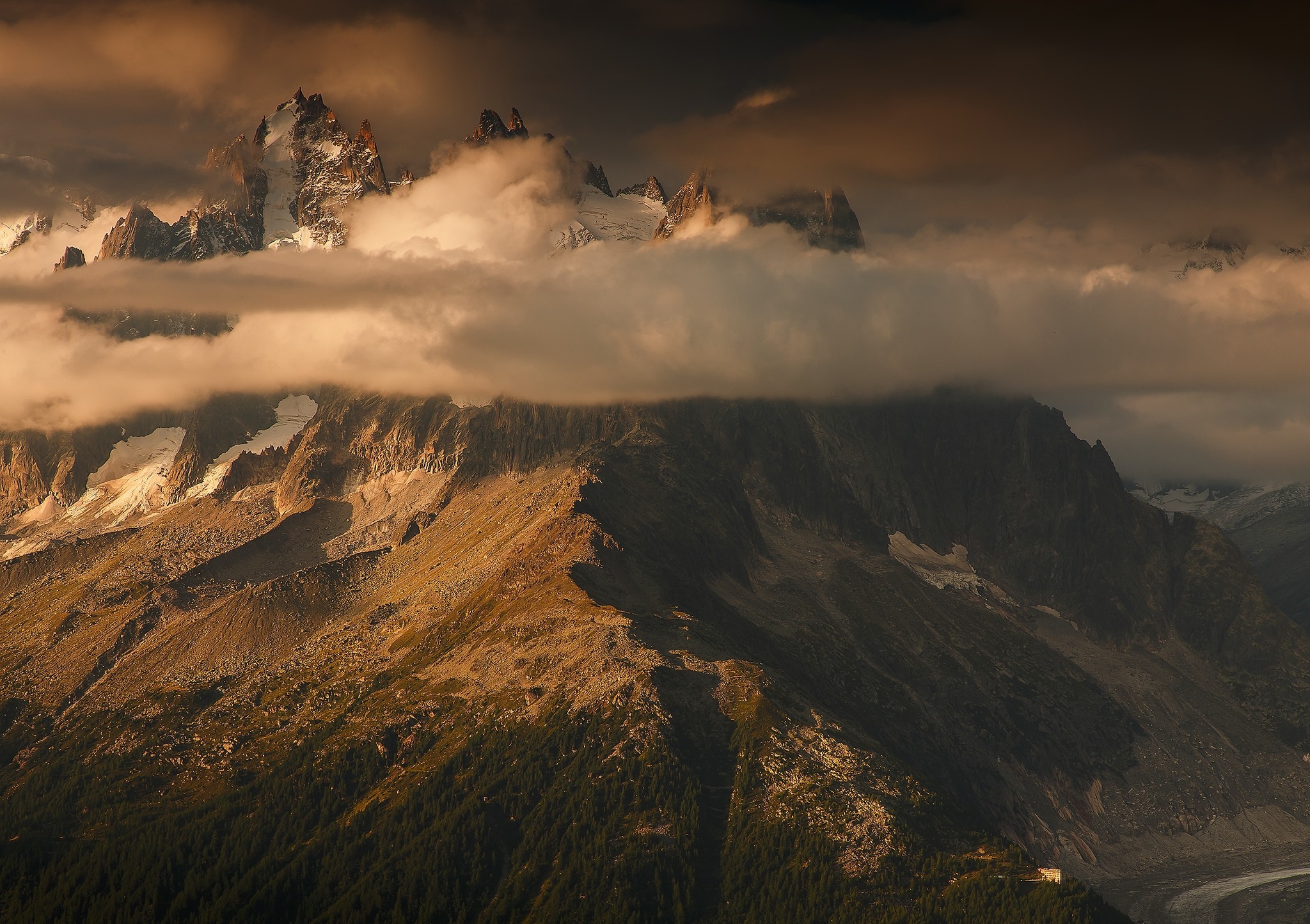 Mountain range with clouds and snow in the Alps HD Wallpaper