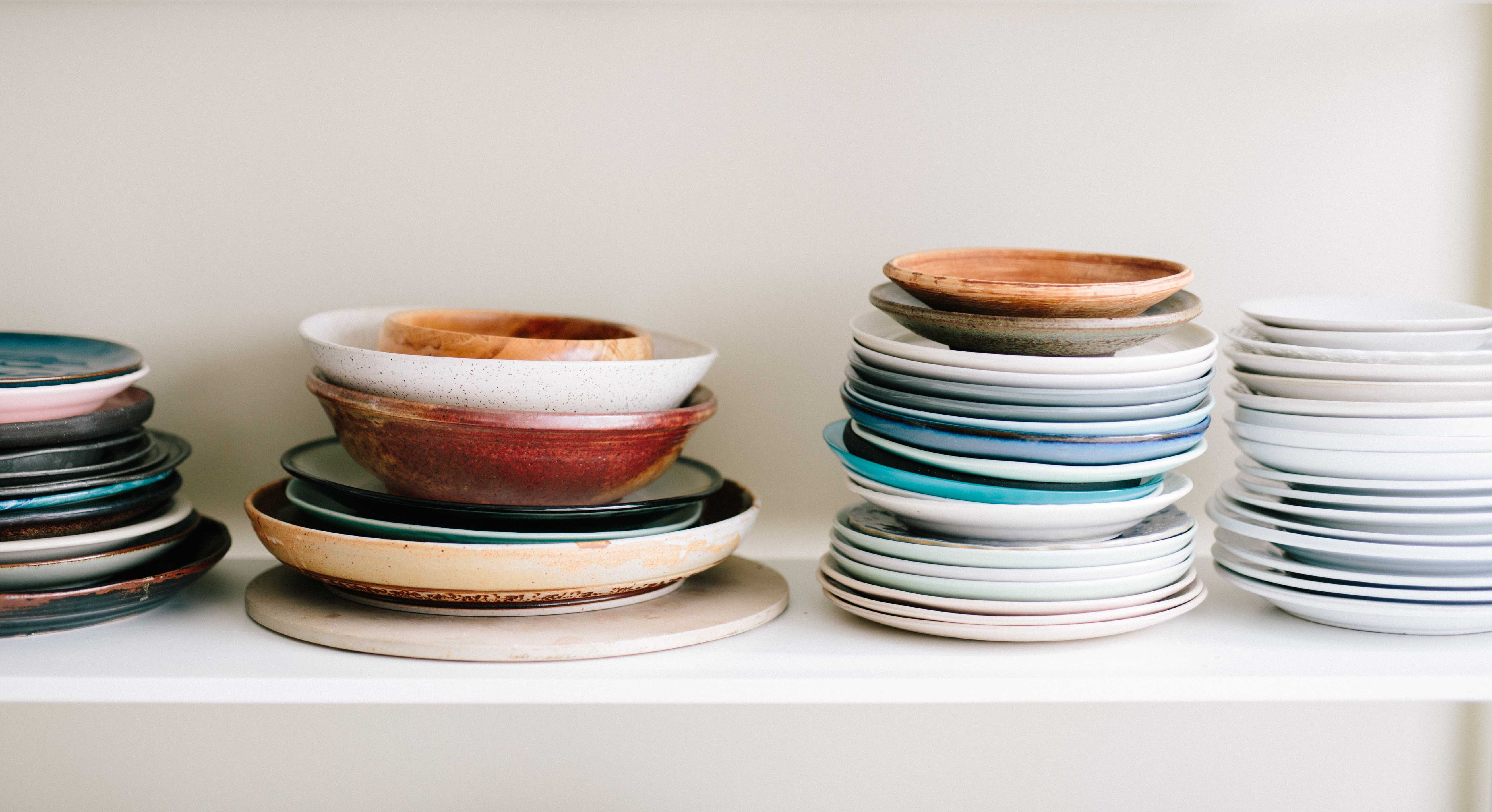 Stacks of Plates and Bowls on a Shelf HD Wallpaper
