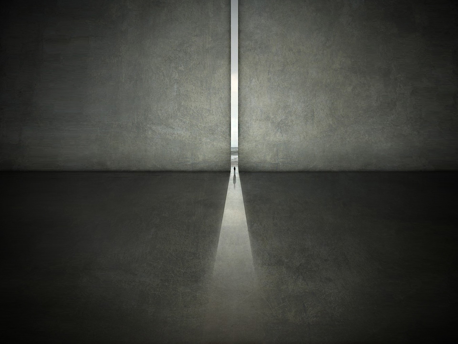 Two men walk through a narrow opening in a concrete wall. HD Wallpaper