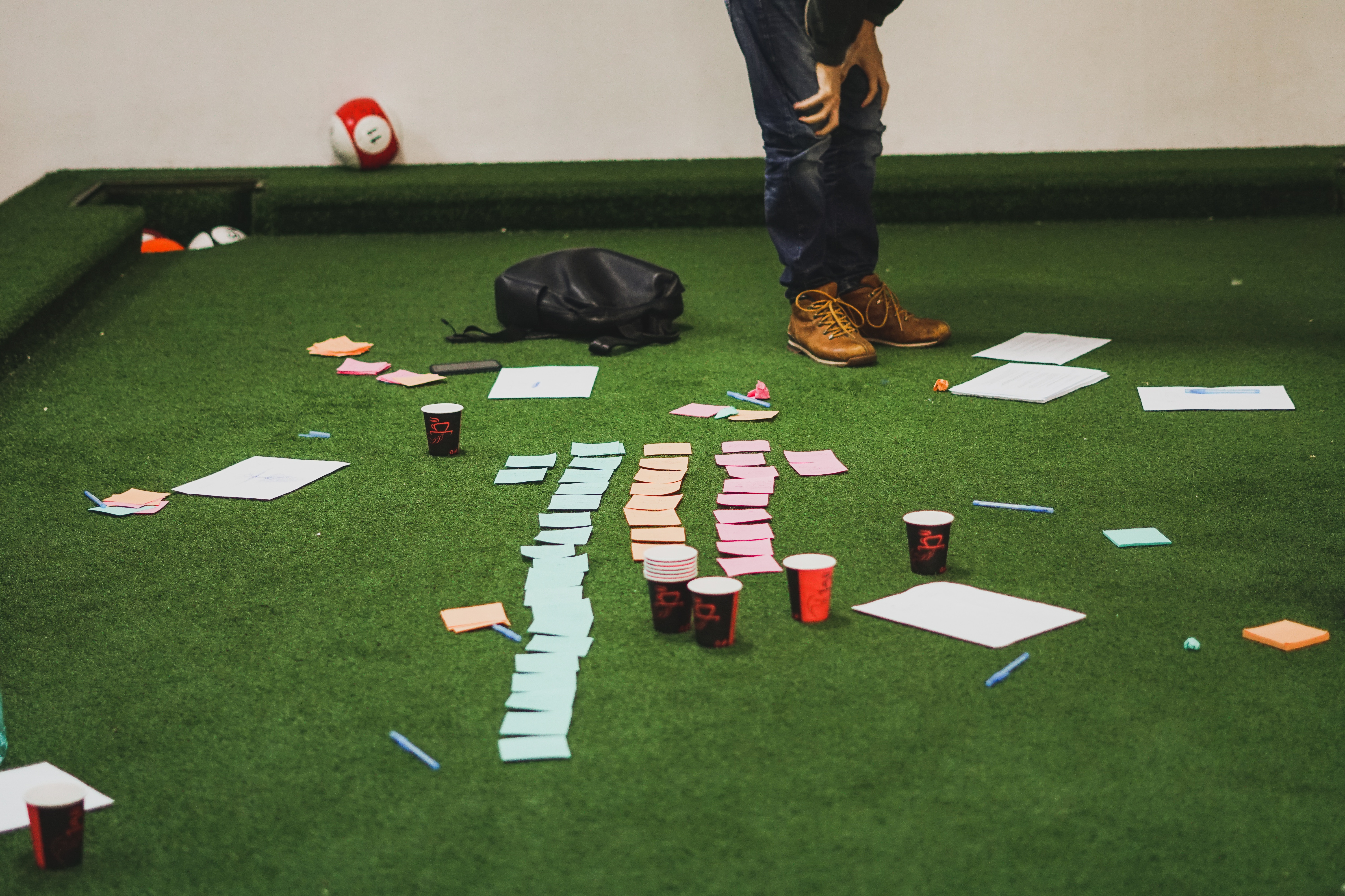 People planning with sticky notes on a pool table HD Wallpaper