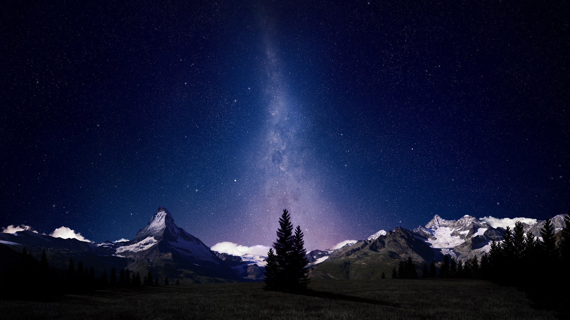 Starry night sky over snow-capped mountains and trees HD Wallpaper