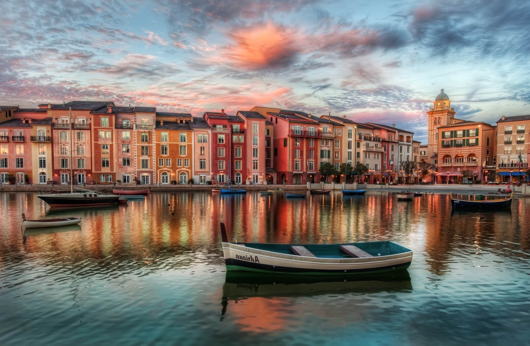 Colorful buildings on a waterfront with boats at sunset HD Wallpaper