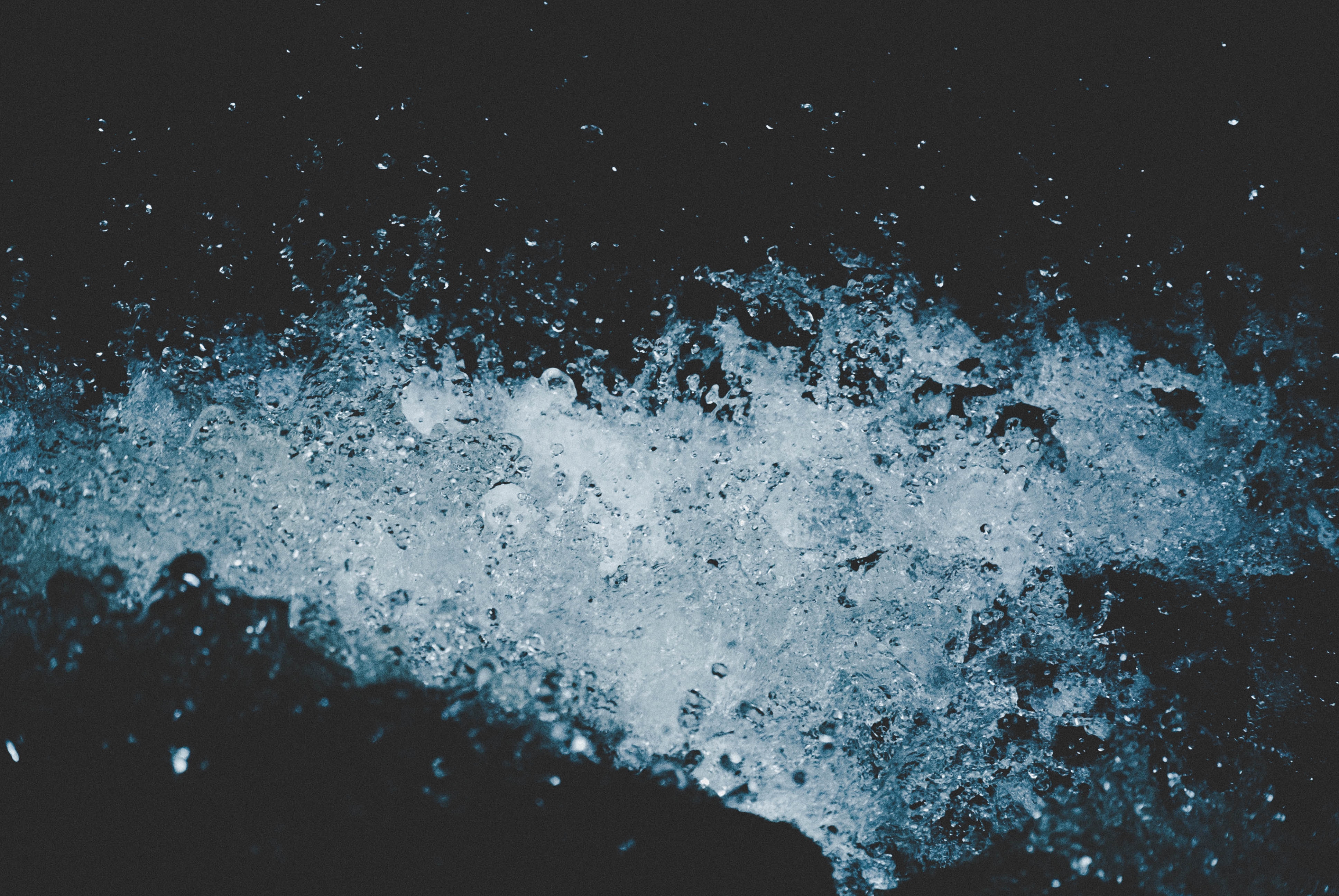 Disturbed water splash with bubbles and droplets HD Wallpaper