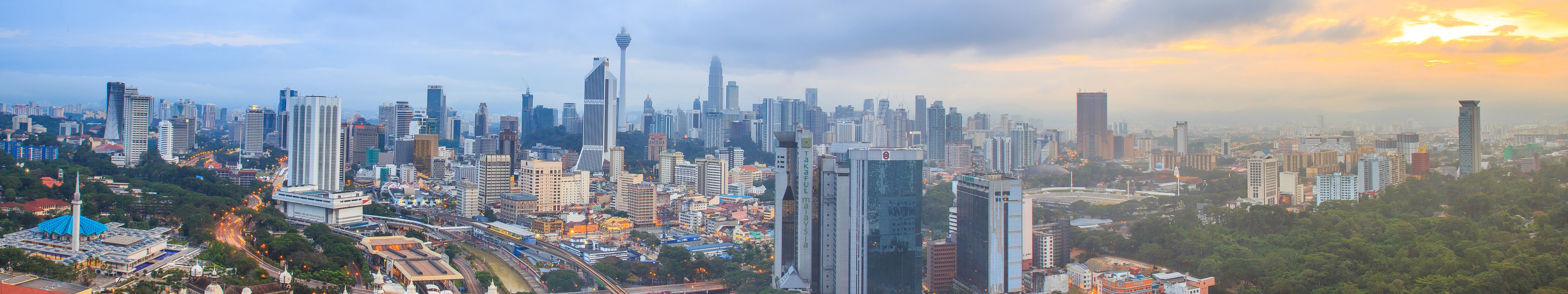 Kuala Lumpur skyline with Petronas Towers at sunrise HD Wallpaper