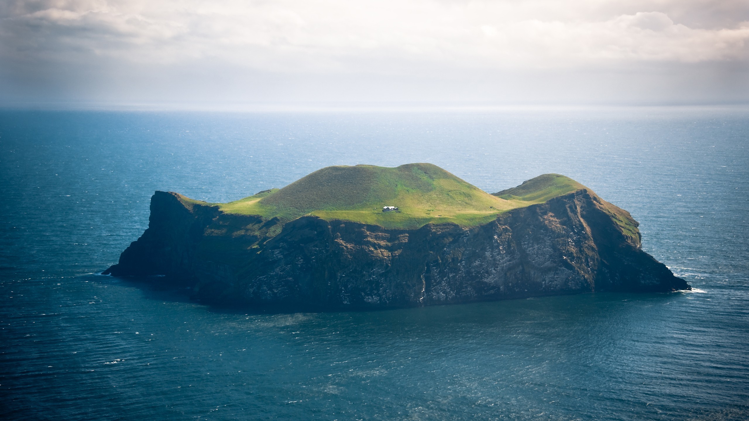 Island with a small house in the sea HD Wallpaper
