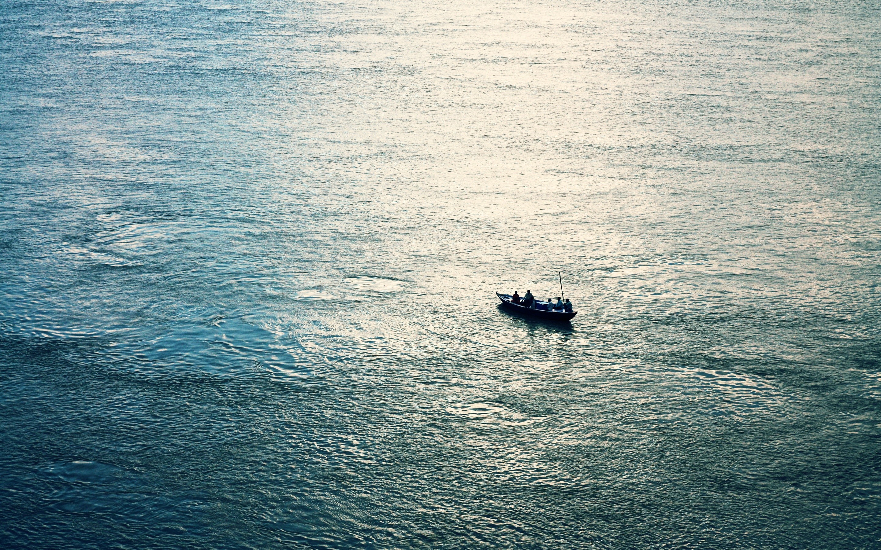 Boat with fishermen on a wide body of water HD Wallpaper