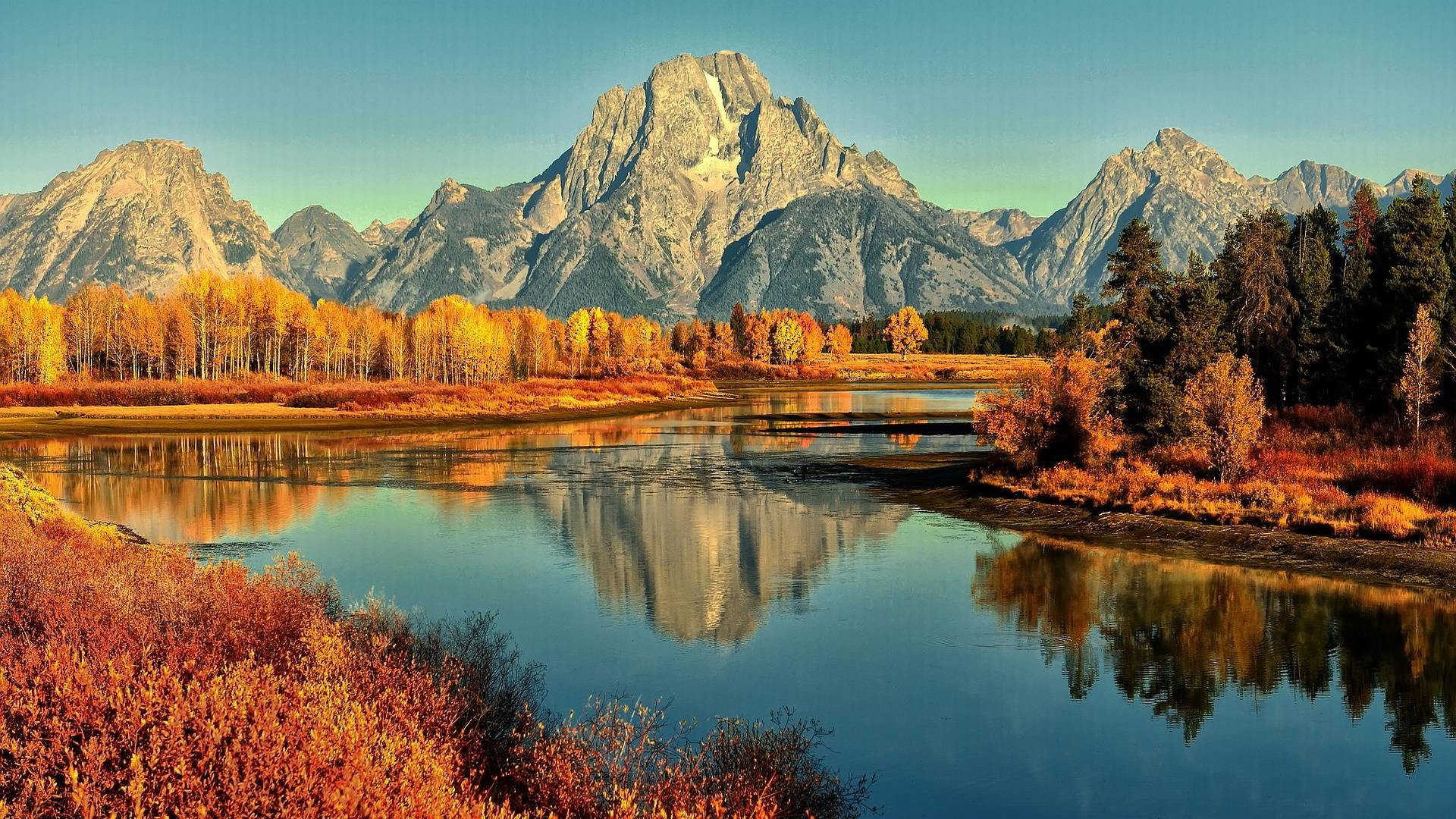 Mountain Range Reflecting on Calm River in Autumn HD Wallpaper