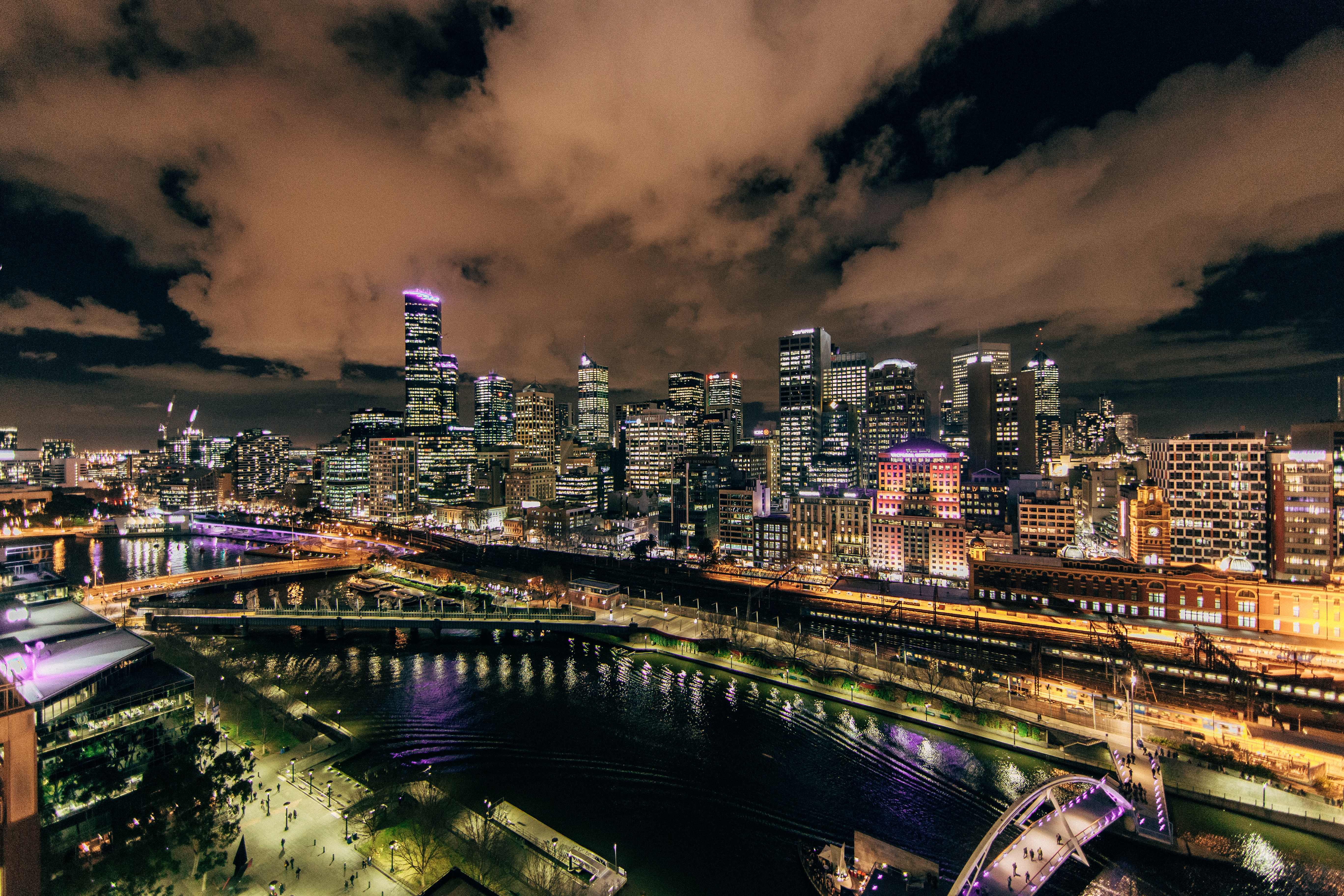 Nighttime Cityscape with River and Bridges HD Wallpaper