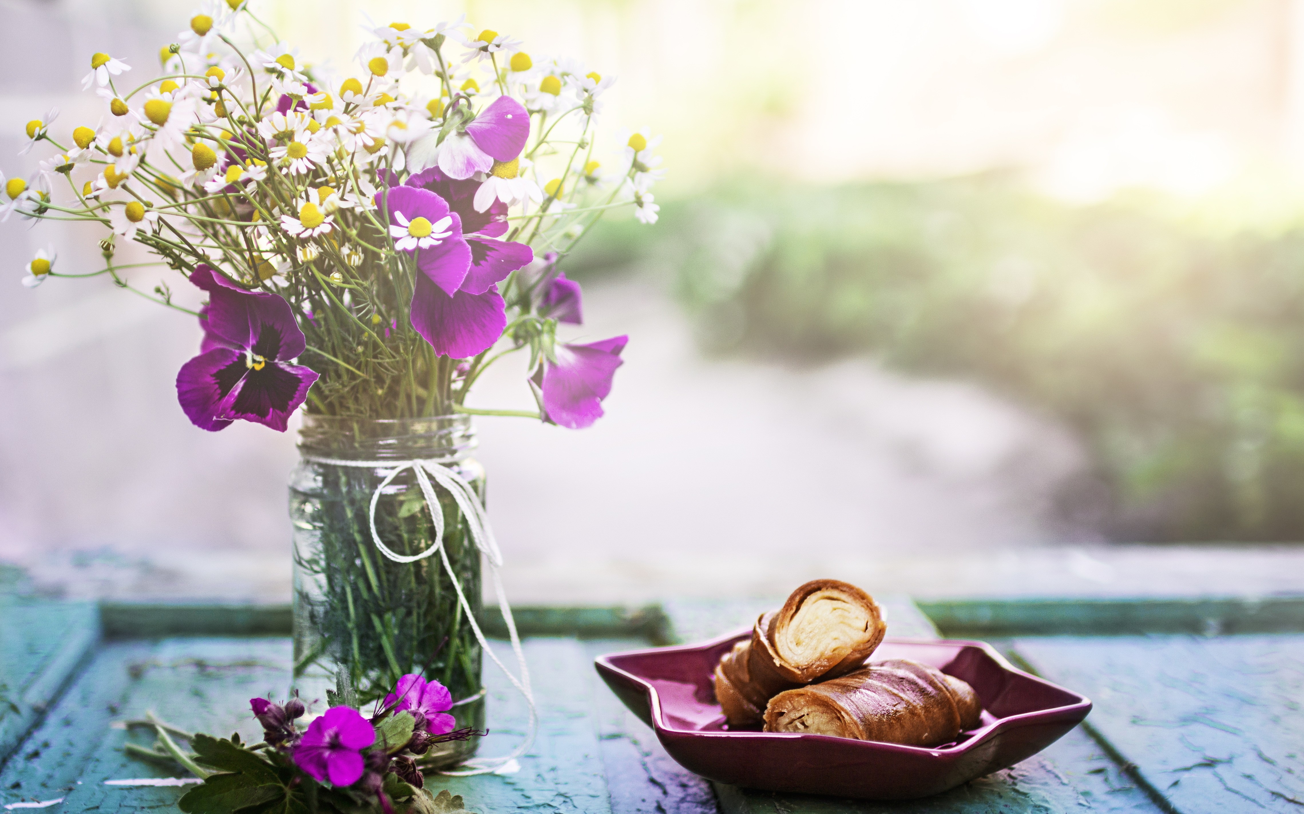Bouquet of daisies and pansies in a jar with croissants HD Wallpaper