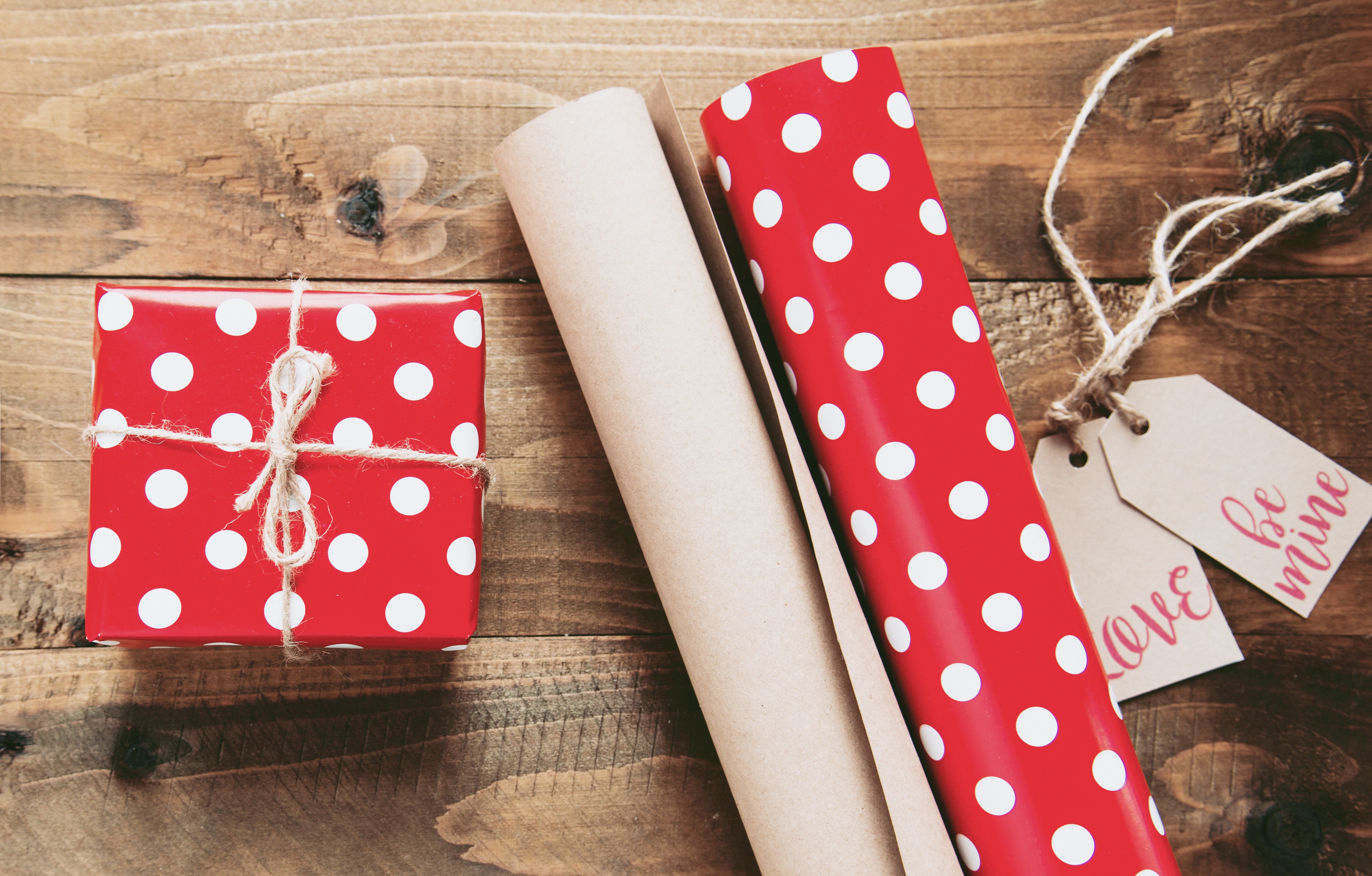 Red polka dot gift box with wrapping paper and tags HD Wallpaper