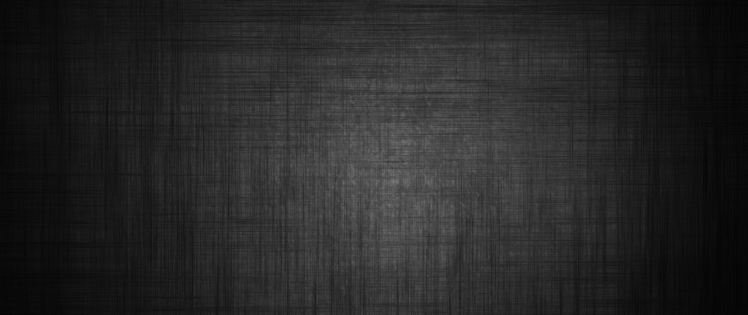 Dark textured surface with subtle lighting HD Wallpaper
