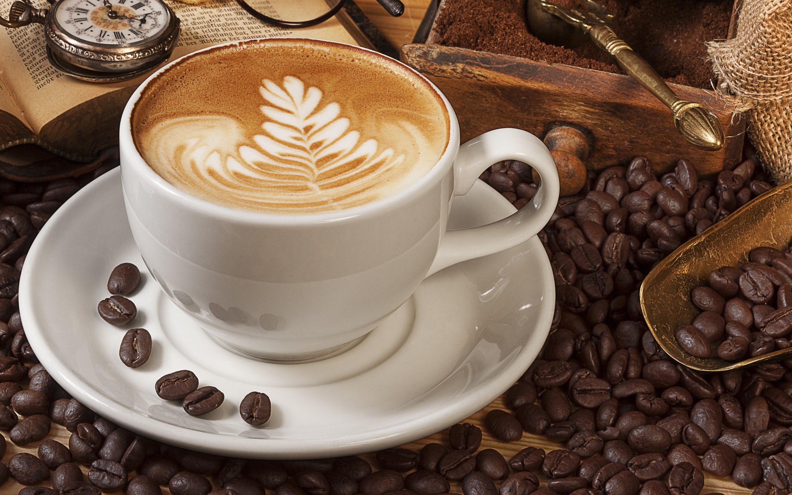 Latte art coffee cup with coffee beans and vintage pocket watch HD Wallpaper