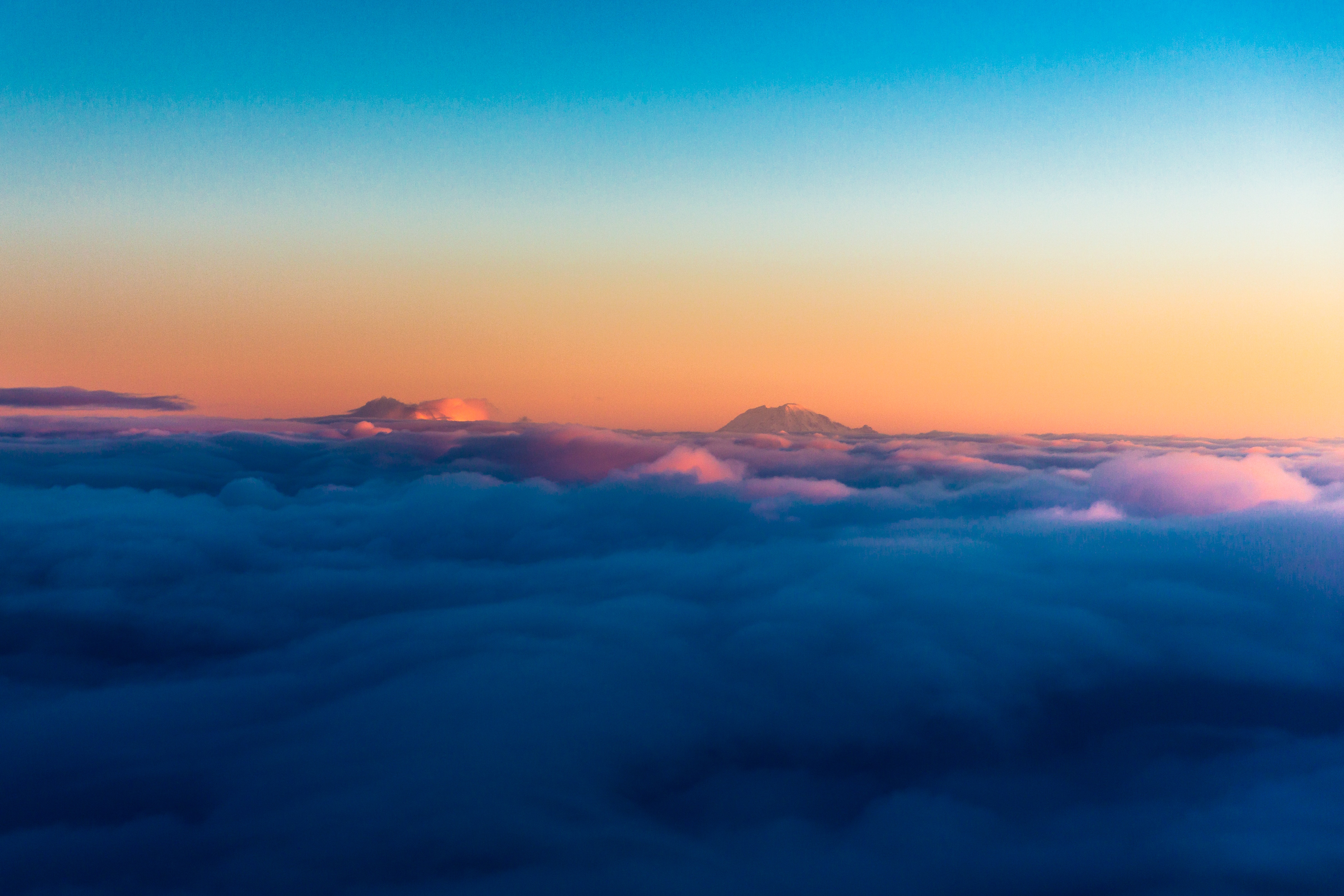 Mountains above clouds at sunrise or sunset HD Wallpaper