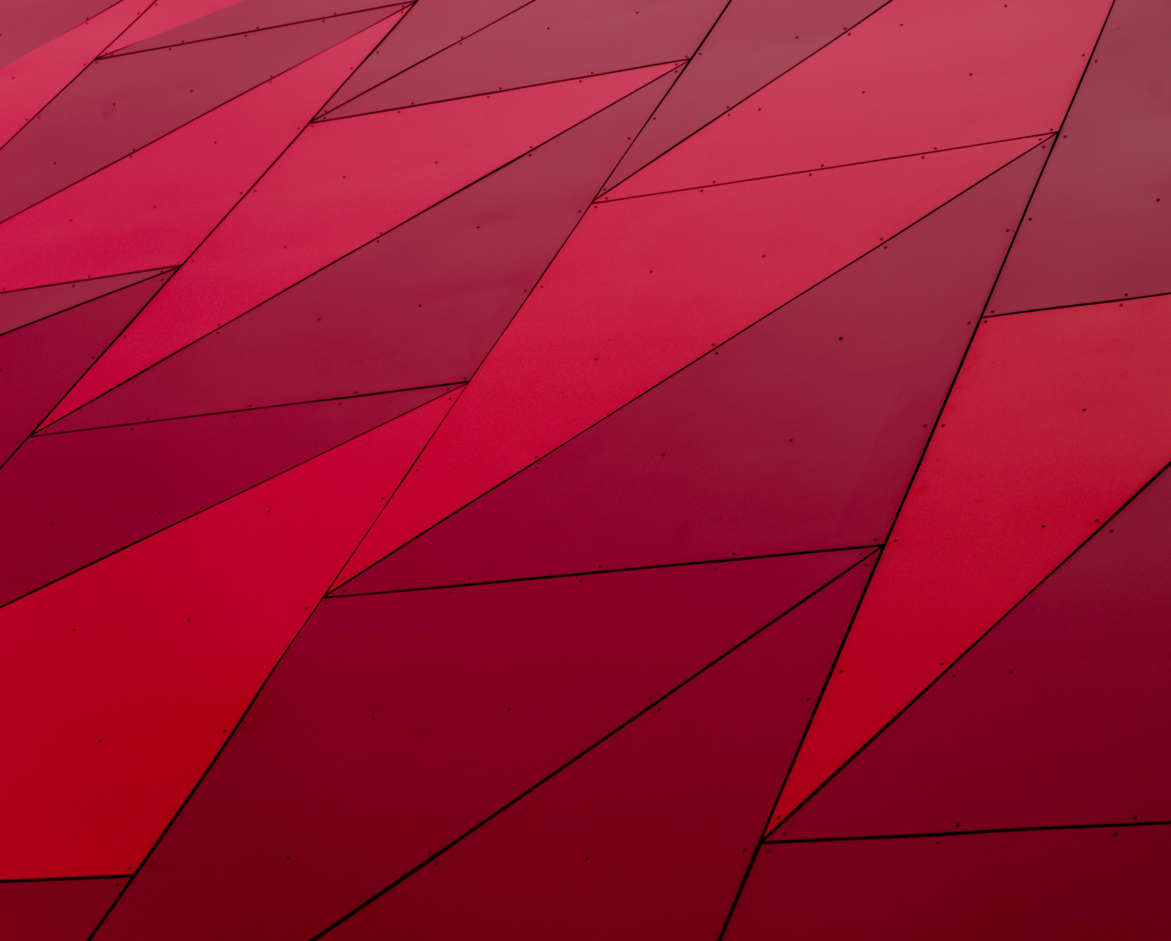 Red geometric cladding with rivets HD Wallpaper