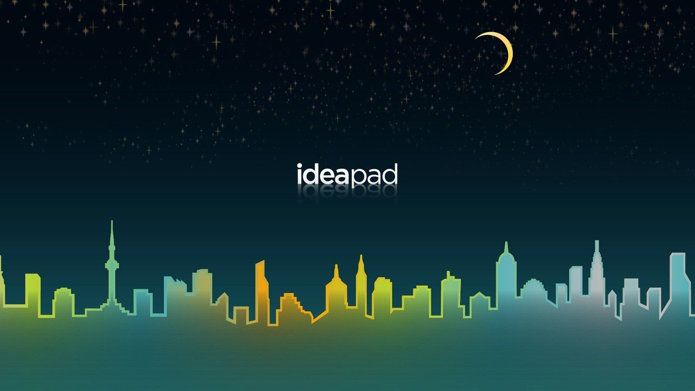 Lenovo Ideapad logo over a stylized cityscape at night HD Wallpaper
