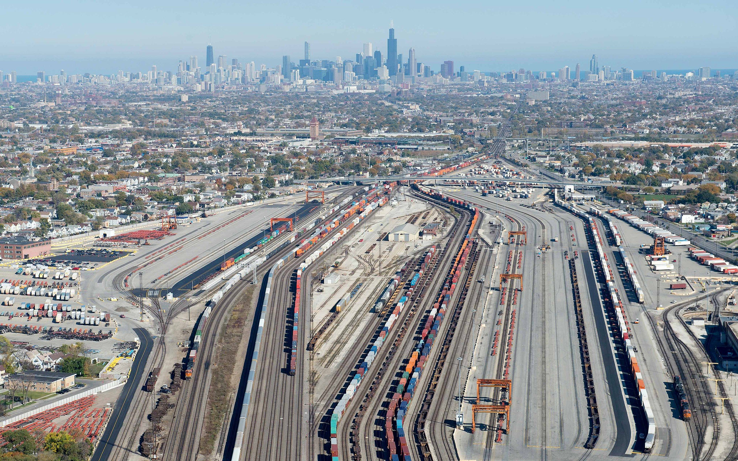Aerial view of Chicago rail yard with city skyline HD Wallpaper