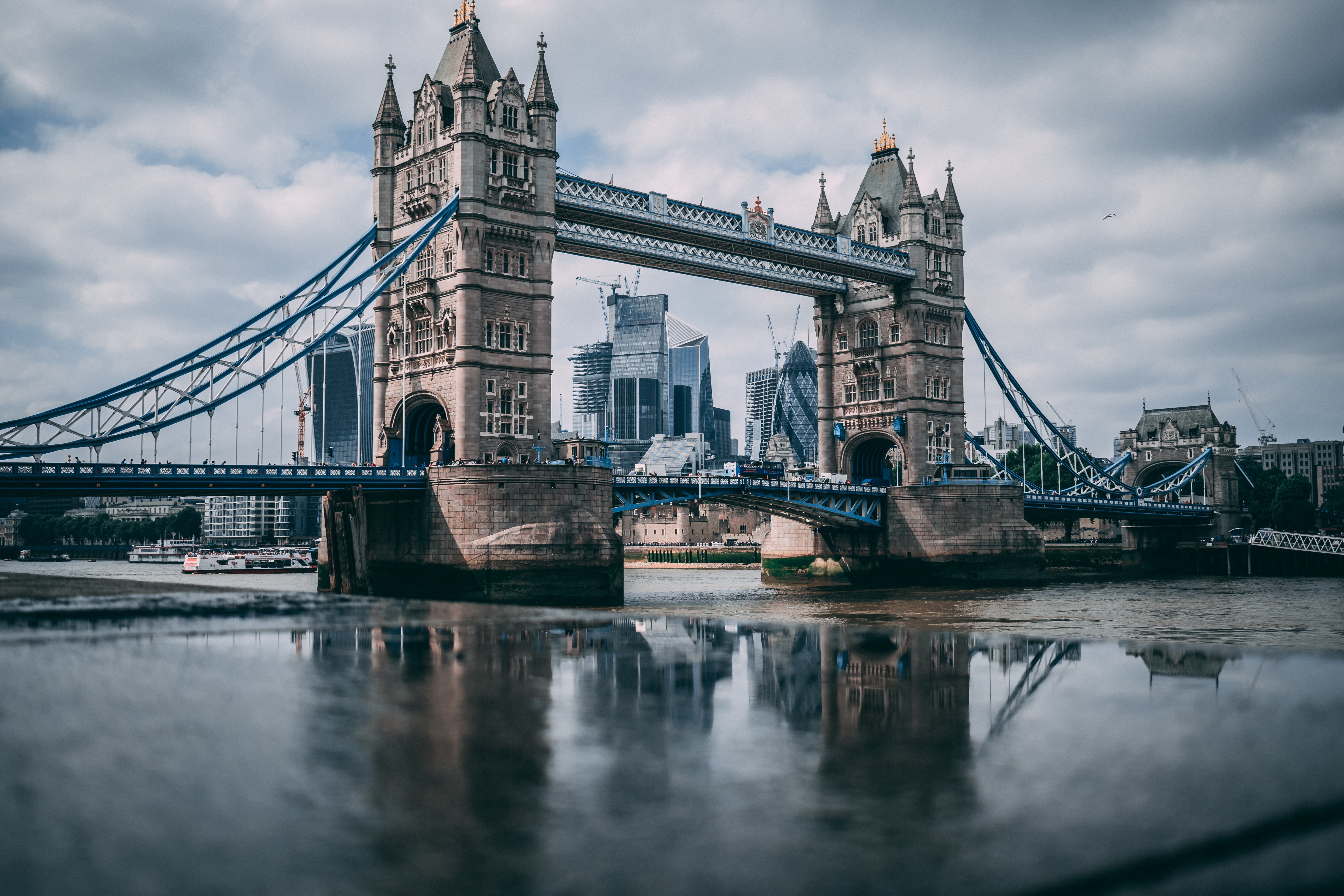 Tower Bridge and London skyline reflected in water HD Wallpaper