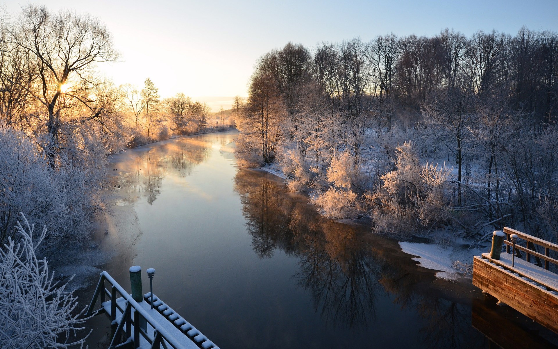 Winter sunrise over a frozen river with frosted trees HD Wallpaper