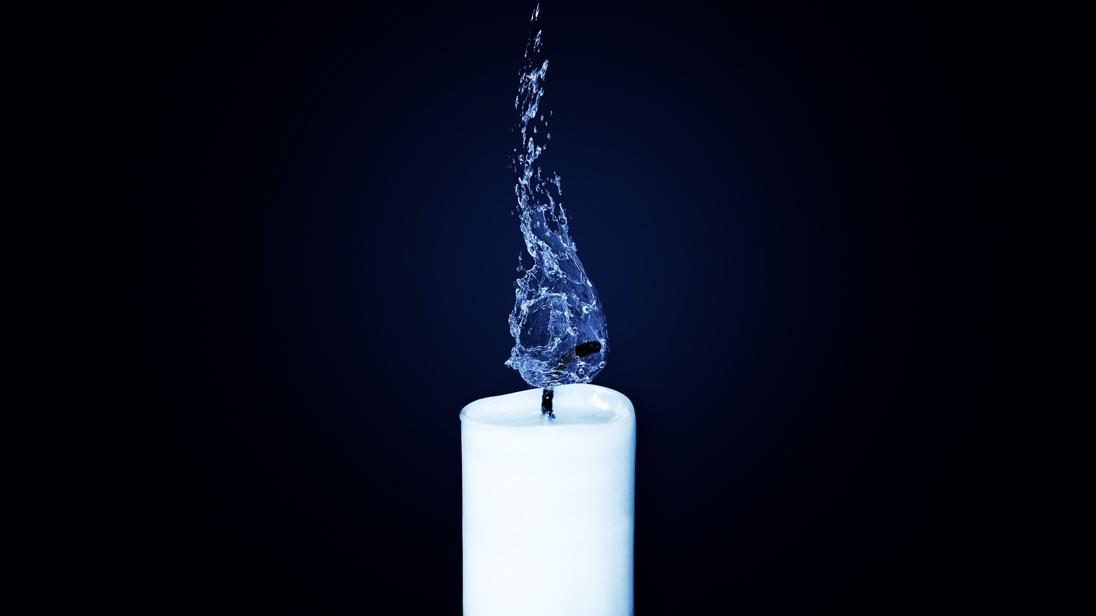 White candle with water flame on dark background HD Wallpaper