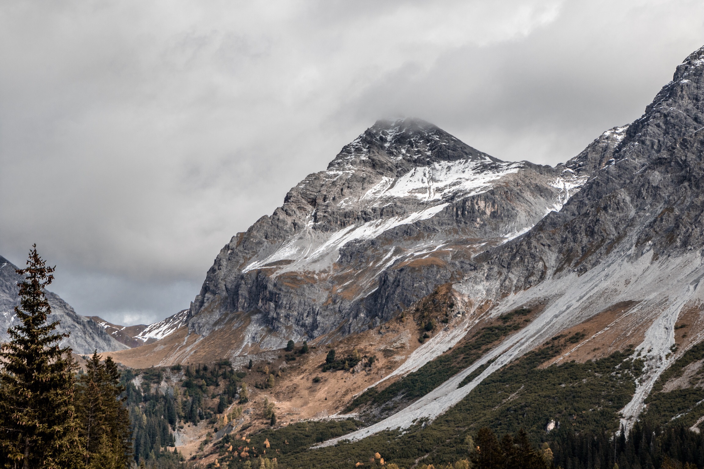 Moody cloudy sky over Swiss Alps mountain ridge HD Wallpaper