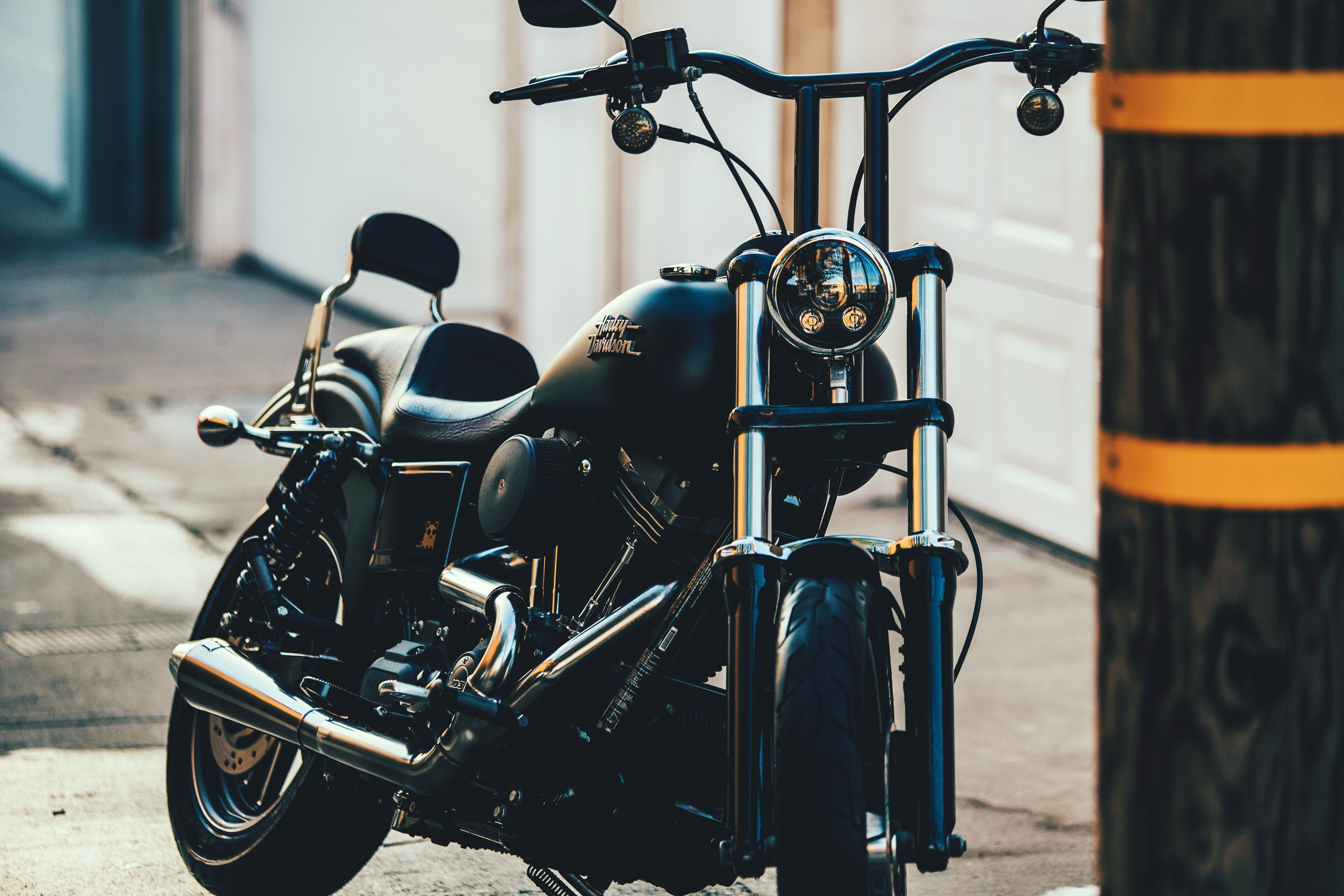 Black Harley Davidson motorcycle parked outdoors HD Wallpaper