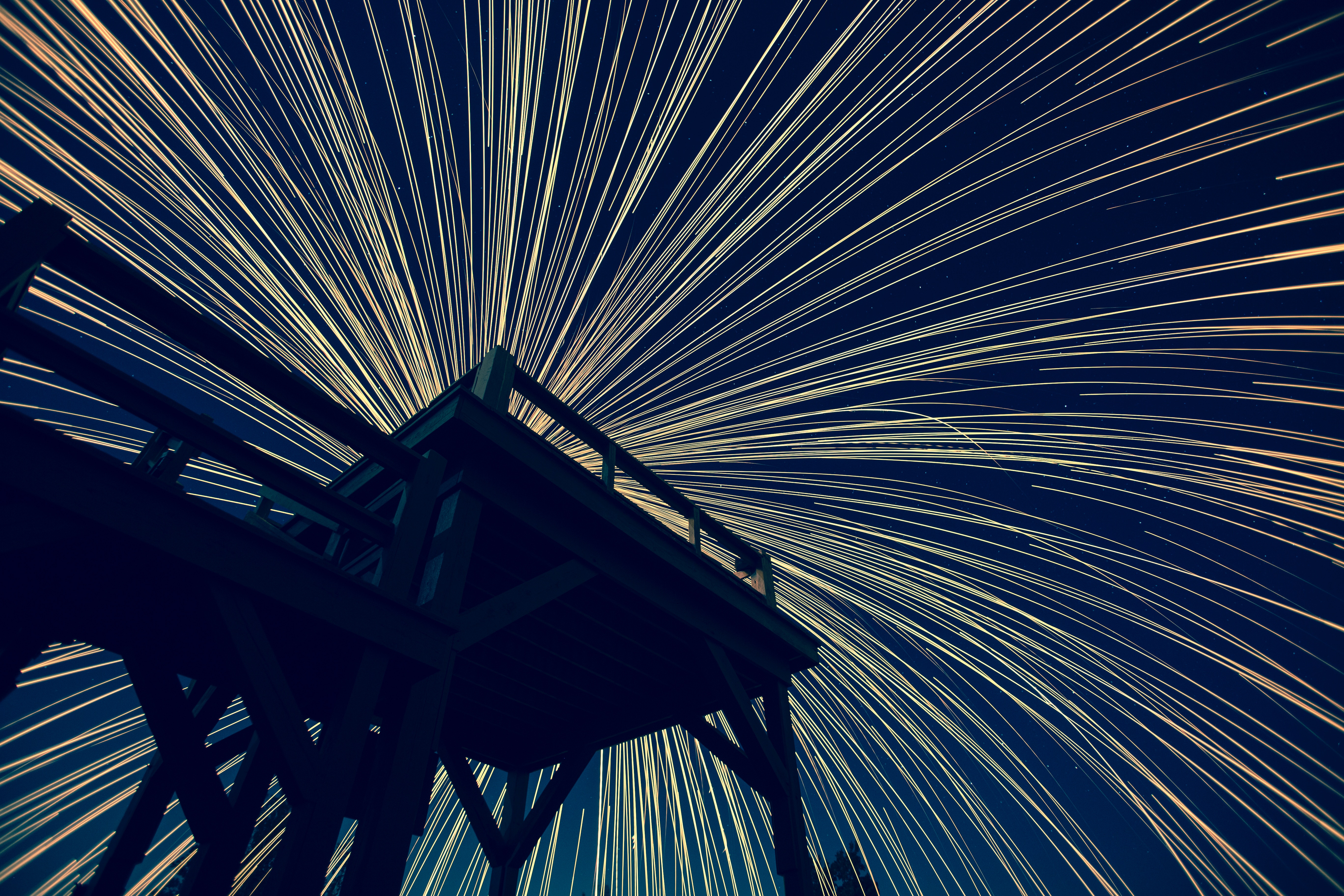 Long exposure light trails from a deck at night HD Wallpaper