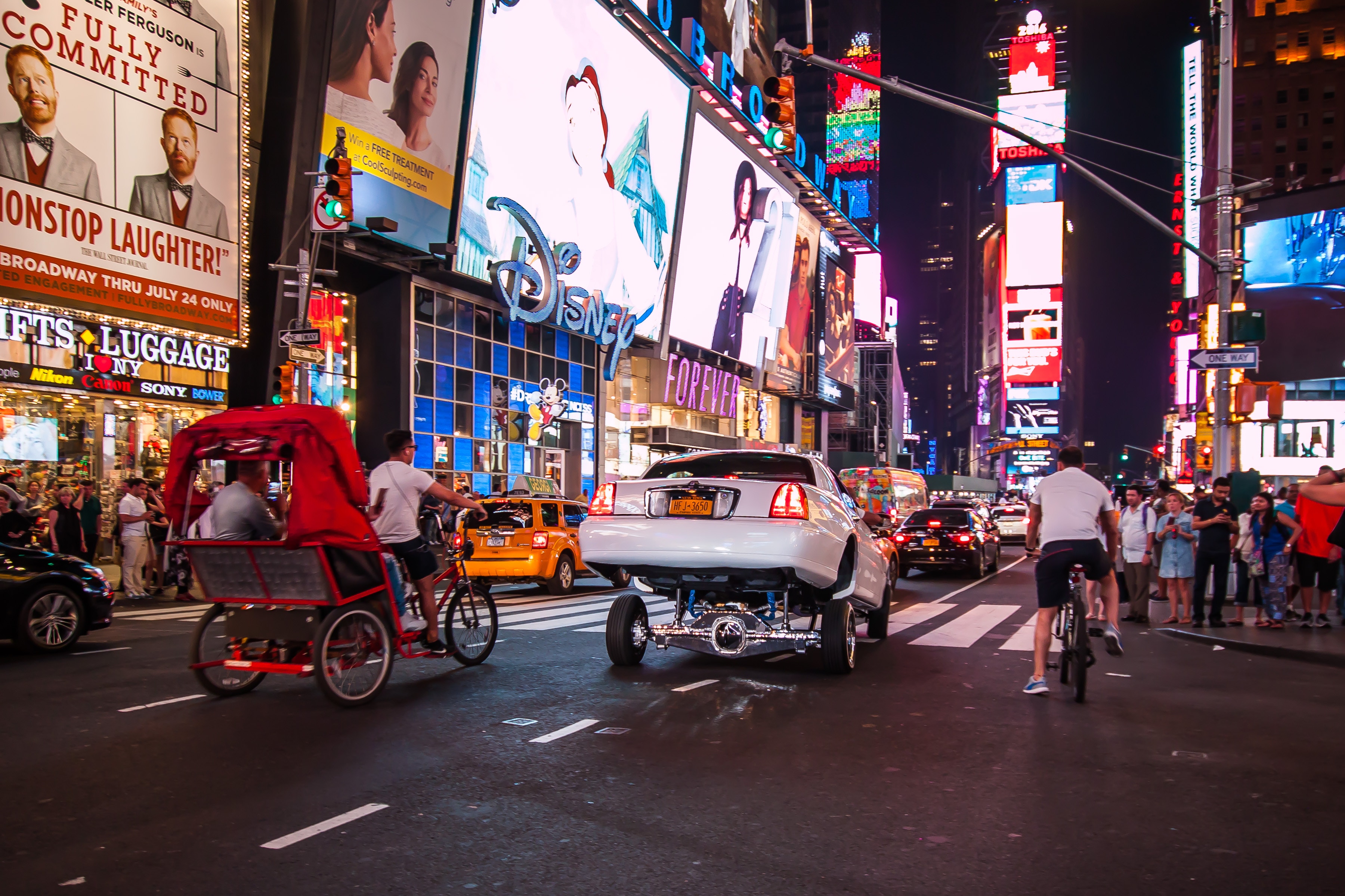 Times Square at Night with Lowrider Car HD Wallpaper
