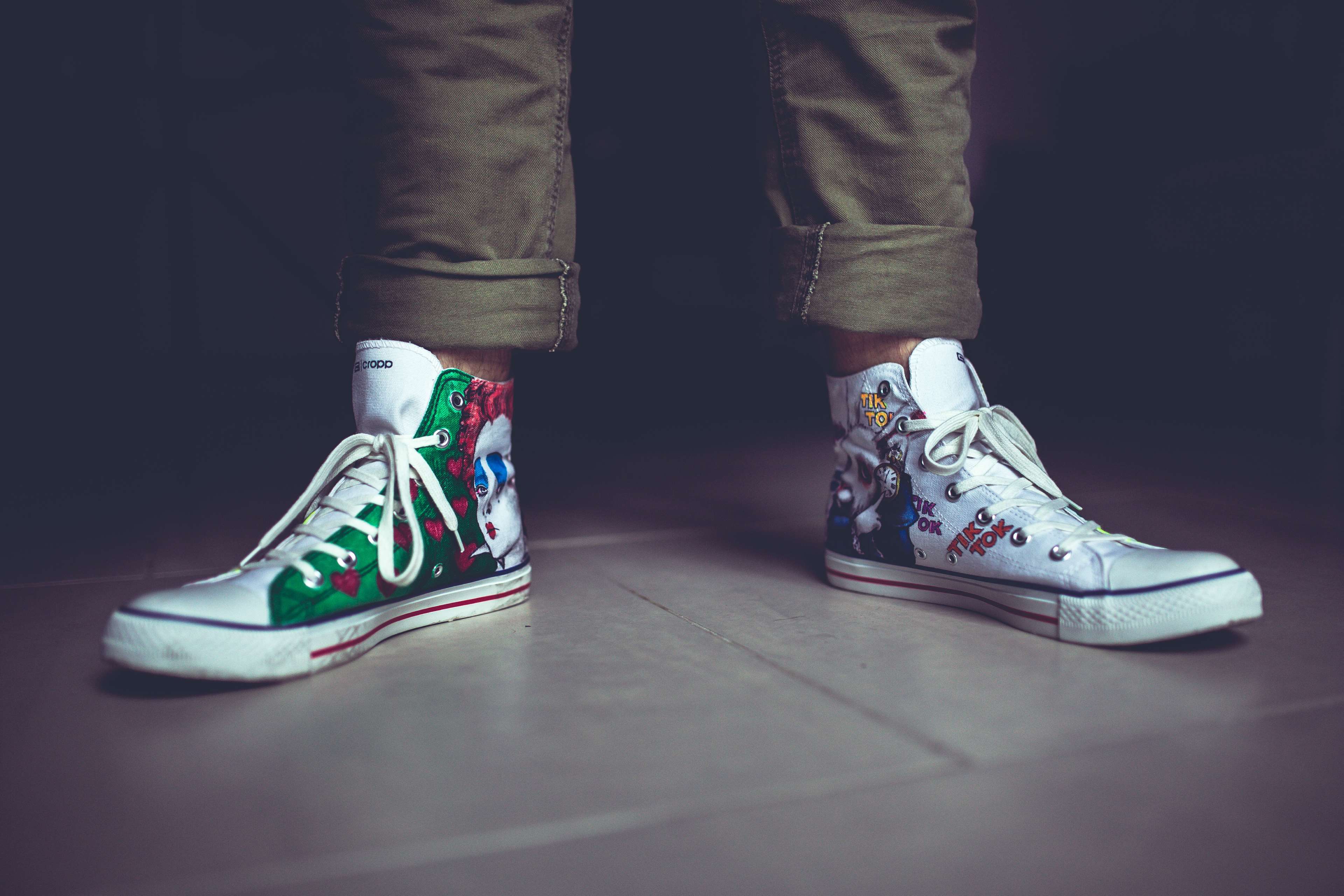 Person wearing custom clown-themed sneakers 4K HD Wallpaper