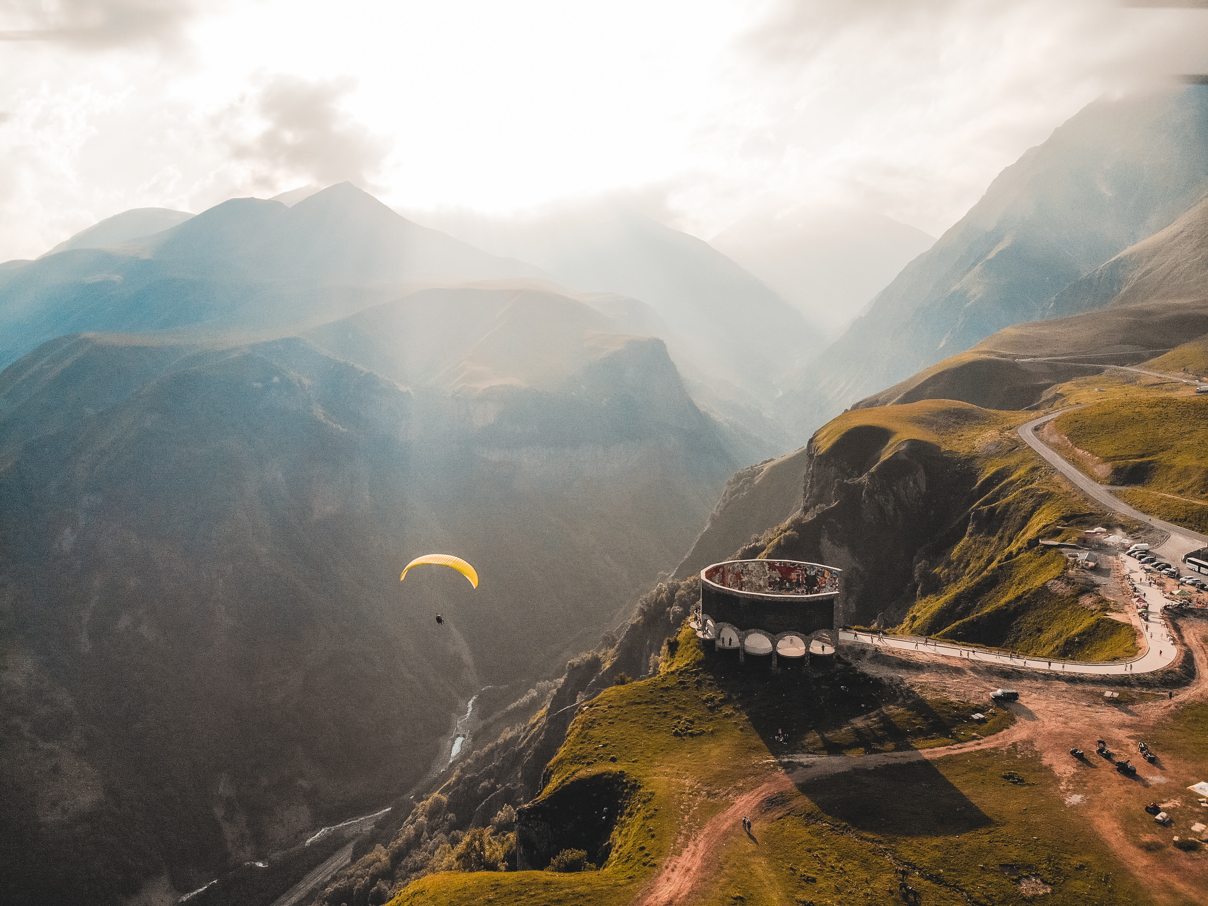 Paraglider over mountains in Georgia HD Wallpaper