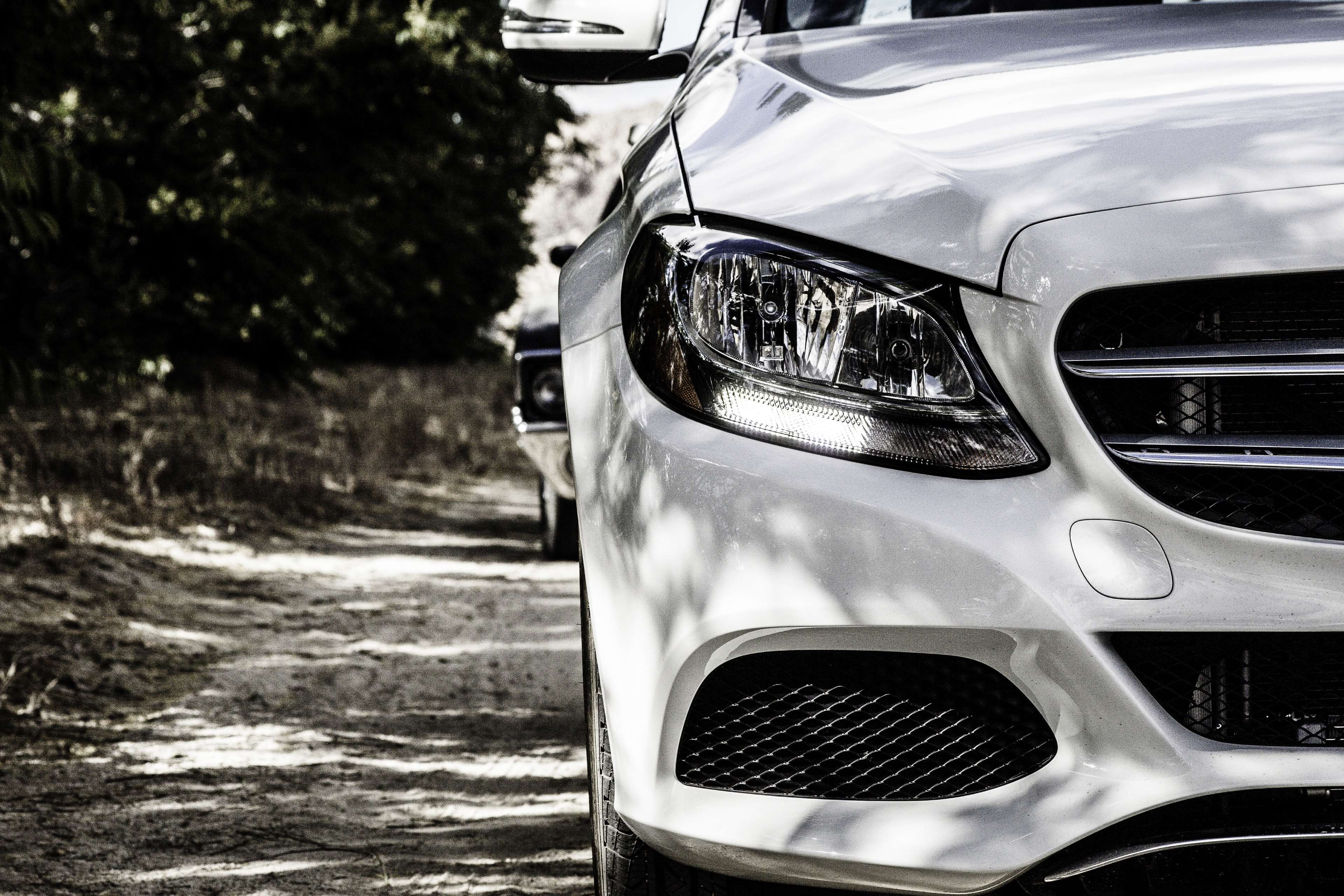 Mercedes-Benz car headlight on a dirt road HD Wallpaper