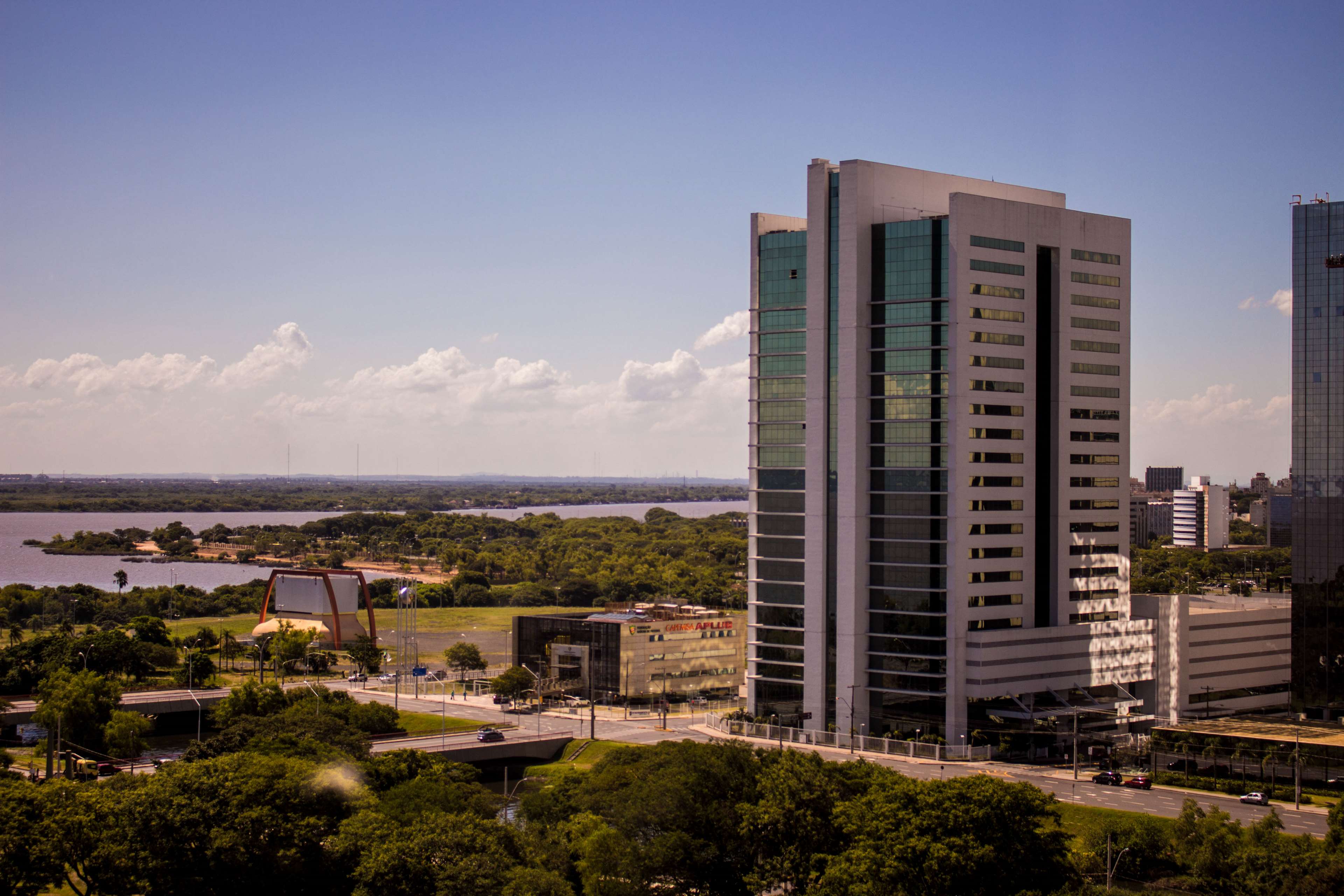 Modern buildings by a lake in Porto Alegre 4K HD Wallpaper