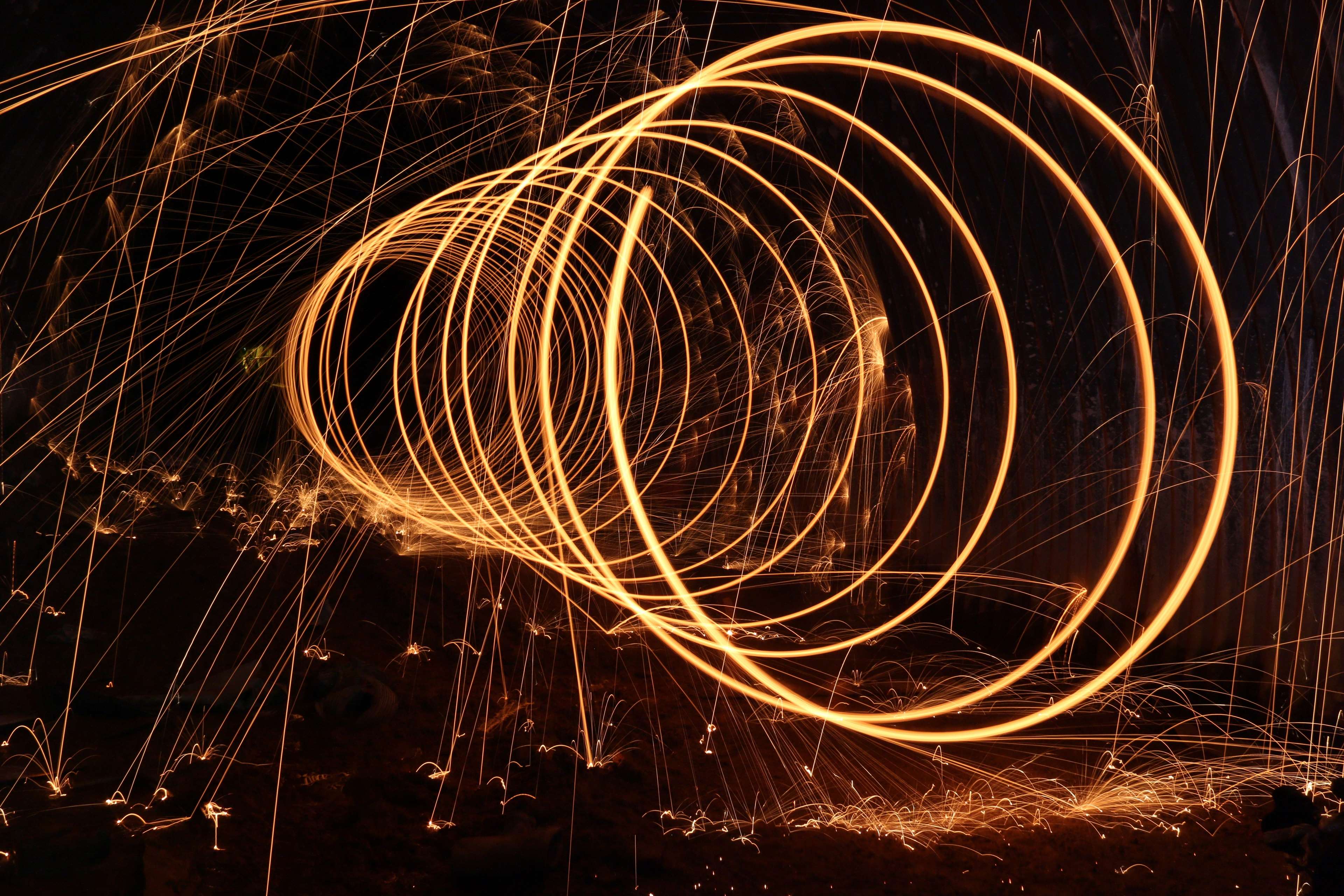 Light painting with sparks at night HD Wallpaper