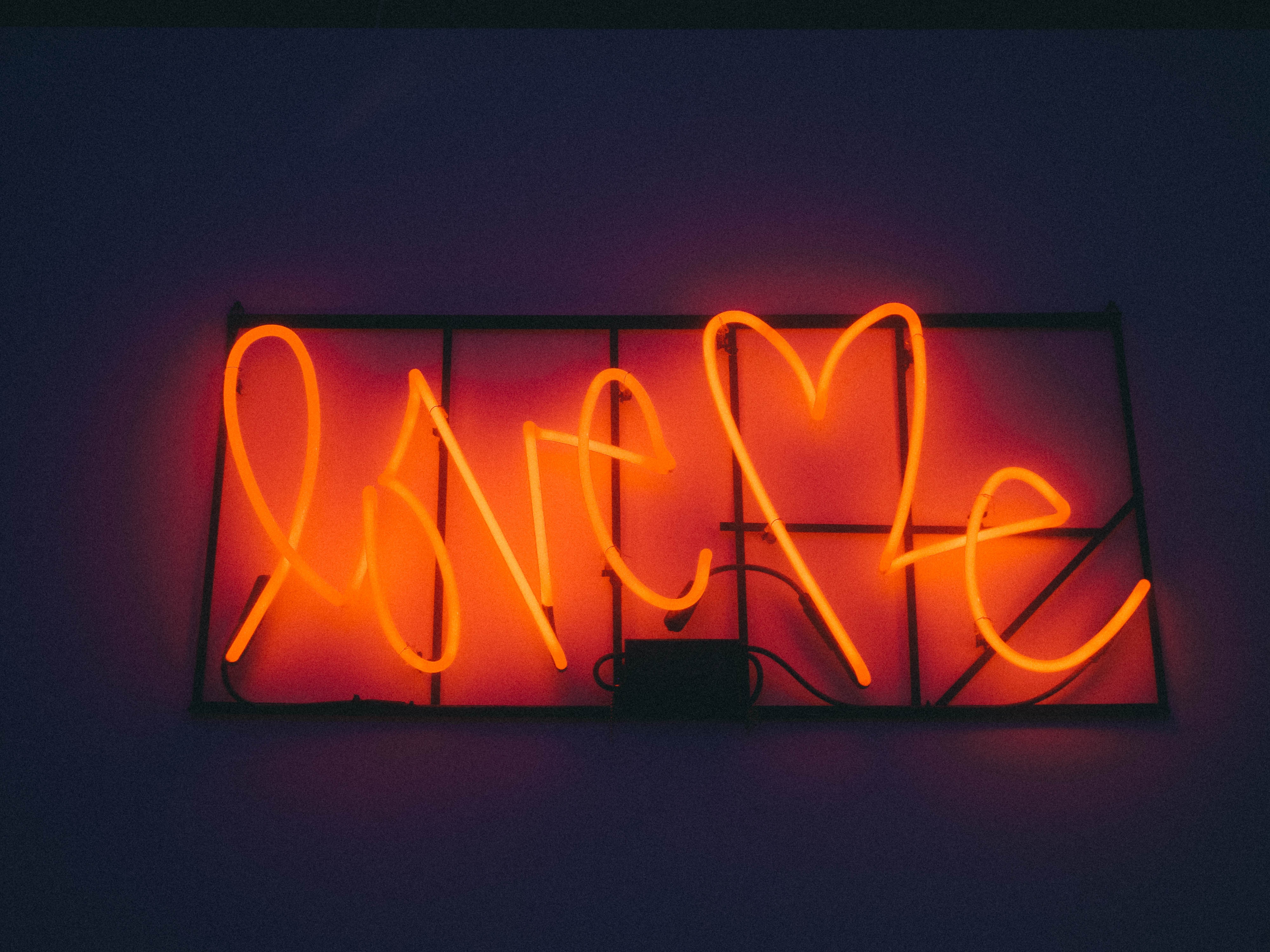Glowing Orange Neon Sign Saying 'Love Me' New York HD Wallpaper