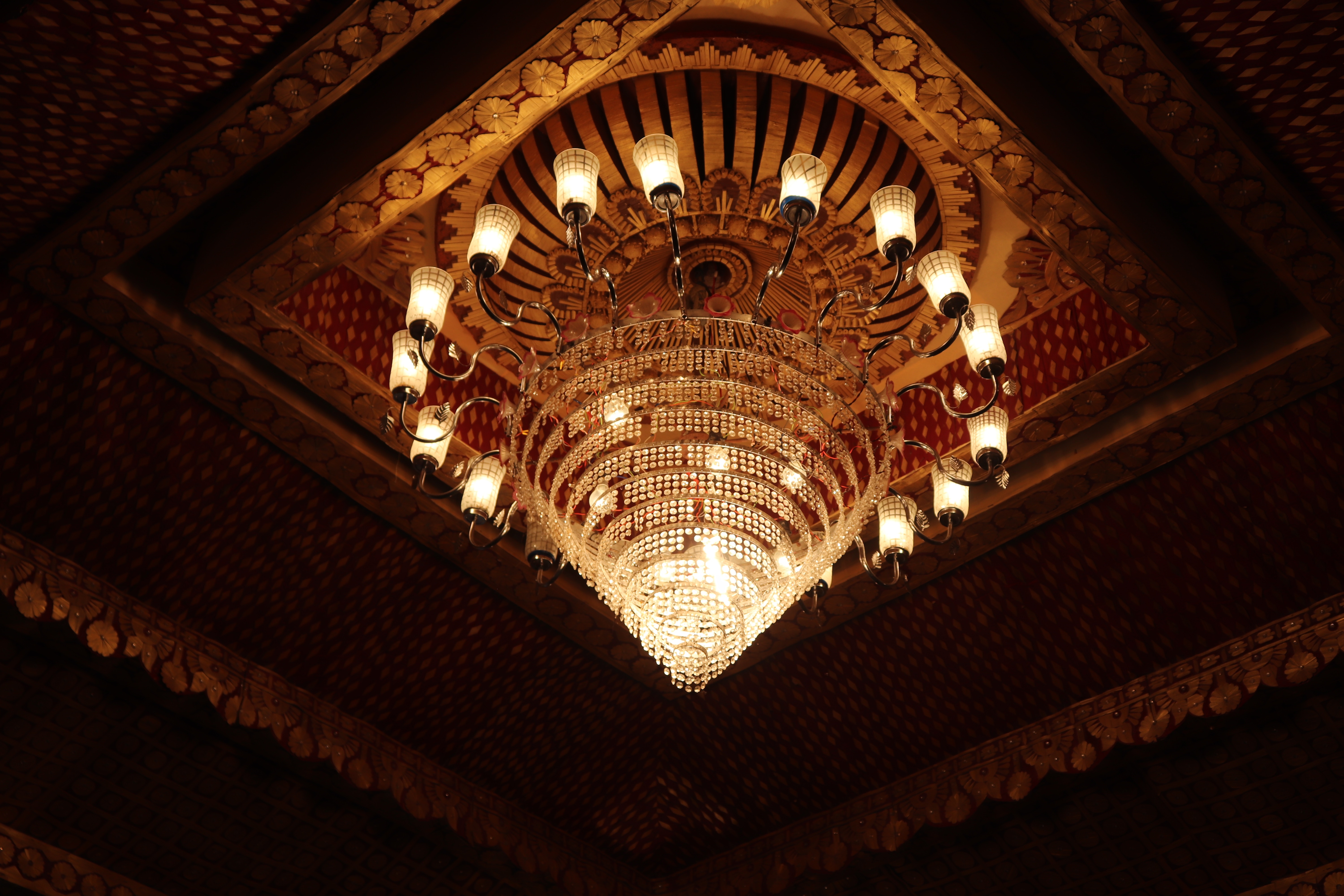 Ornate Chandelier Hanging from a Vaulted Ceiling HD Wallpaper
